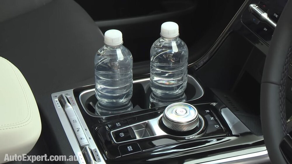 Cup holders are located away from key functions.