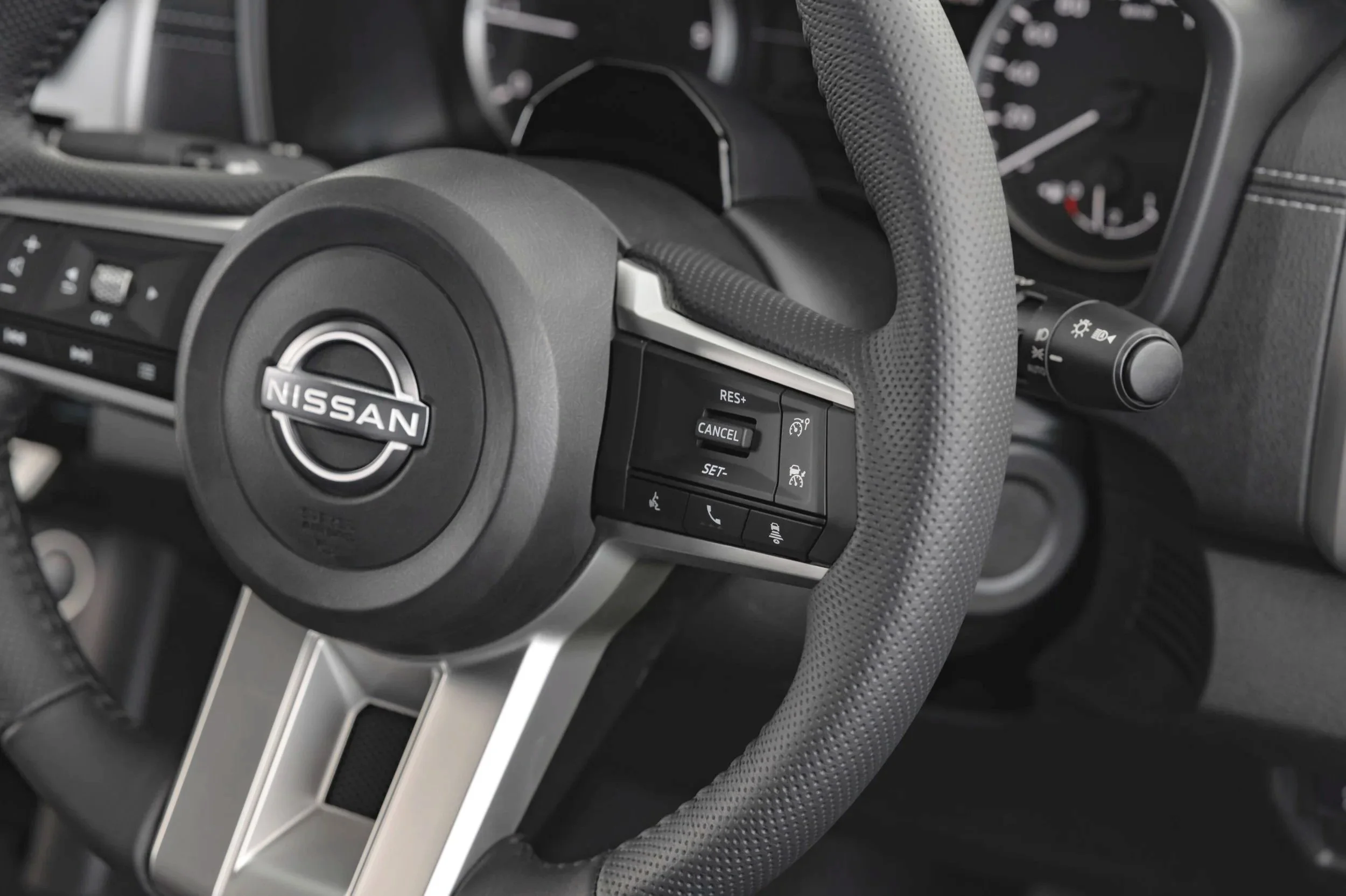 Cruise control settings on the RHS; audio controls on the RHS