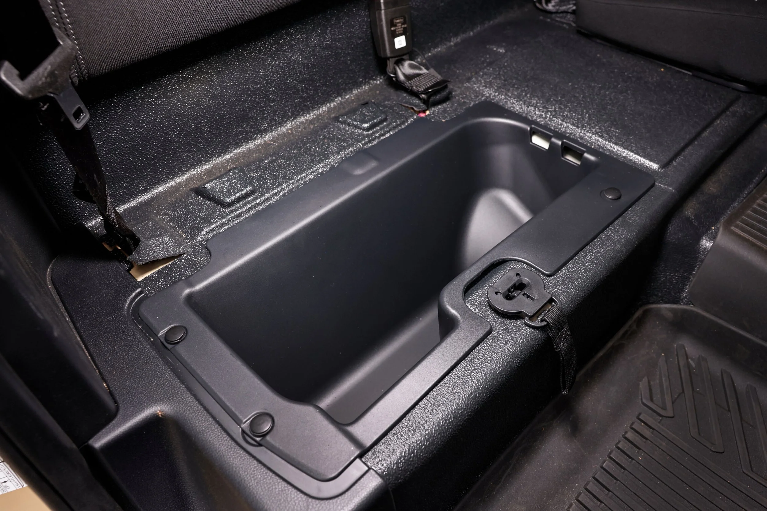 Seat base lifts up to reveal sealed storage