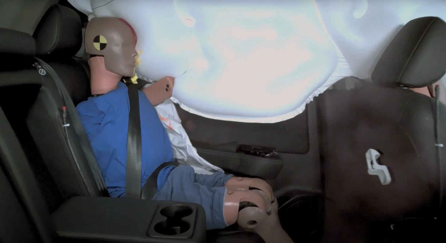 ...while rear passenger's head comes dangerously close to missing the airbag and hitting the C-pillar 