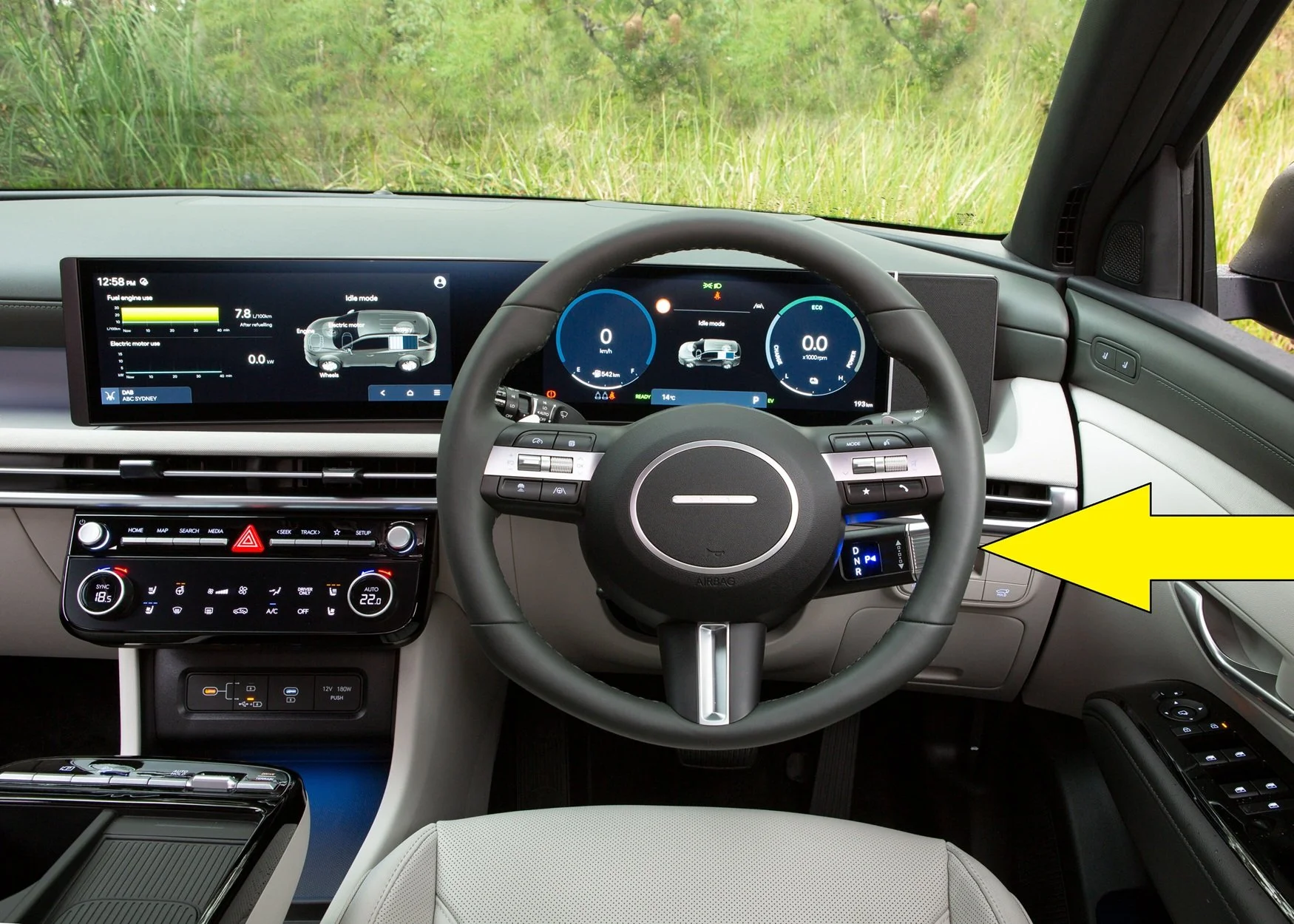 You'll find the stalk behind the steering wheel: twist it thumb-forward for 'Drive' and thumb-down for 'Reverse'