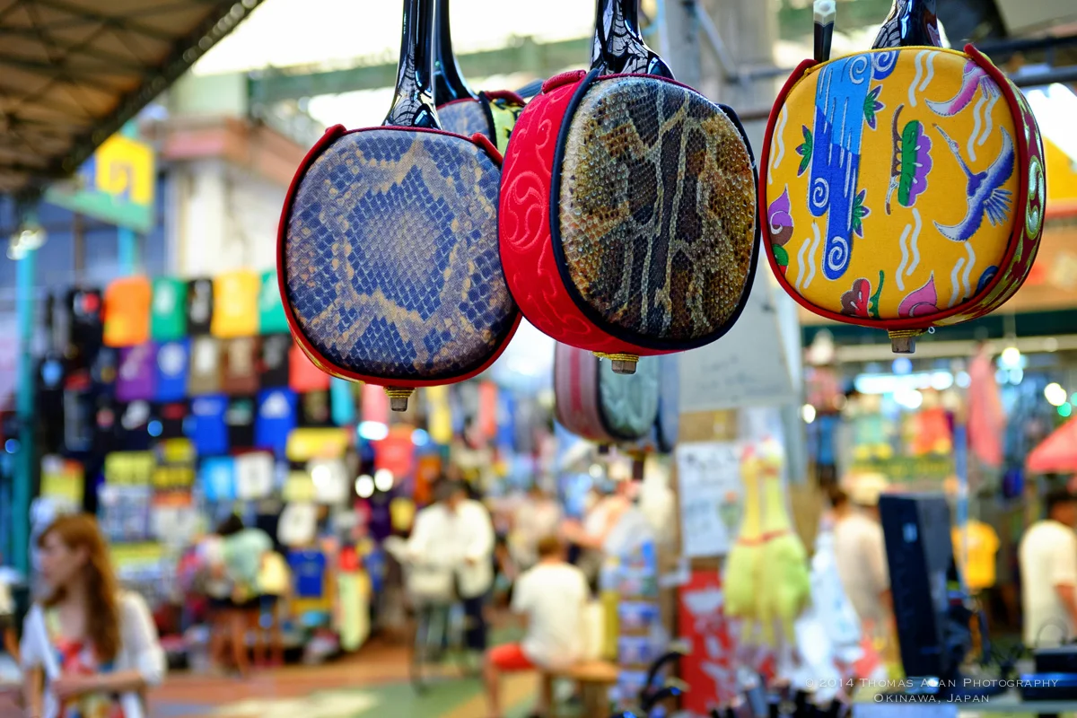 Naha Market. Fuji x100s with TCL-X100 Teleconverter Lens. Fuji Provia camera profile and Lens Correction applied. f/2.8, 1/220 sec, ISO 800. Slightly edited to darken the background.
