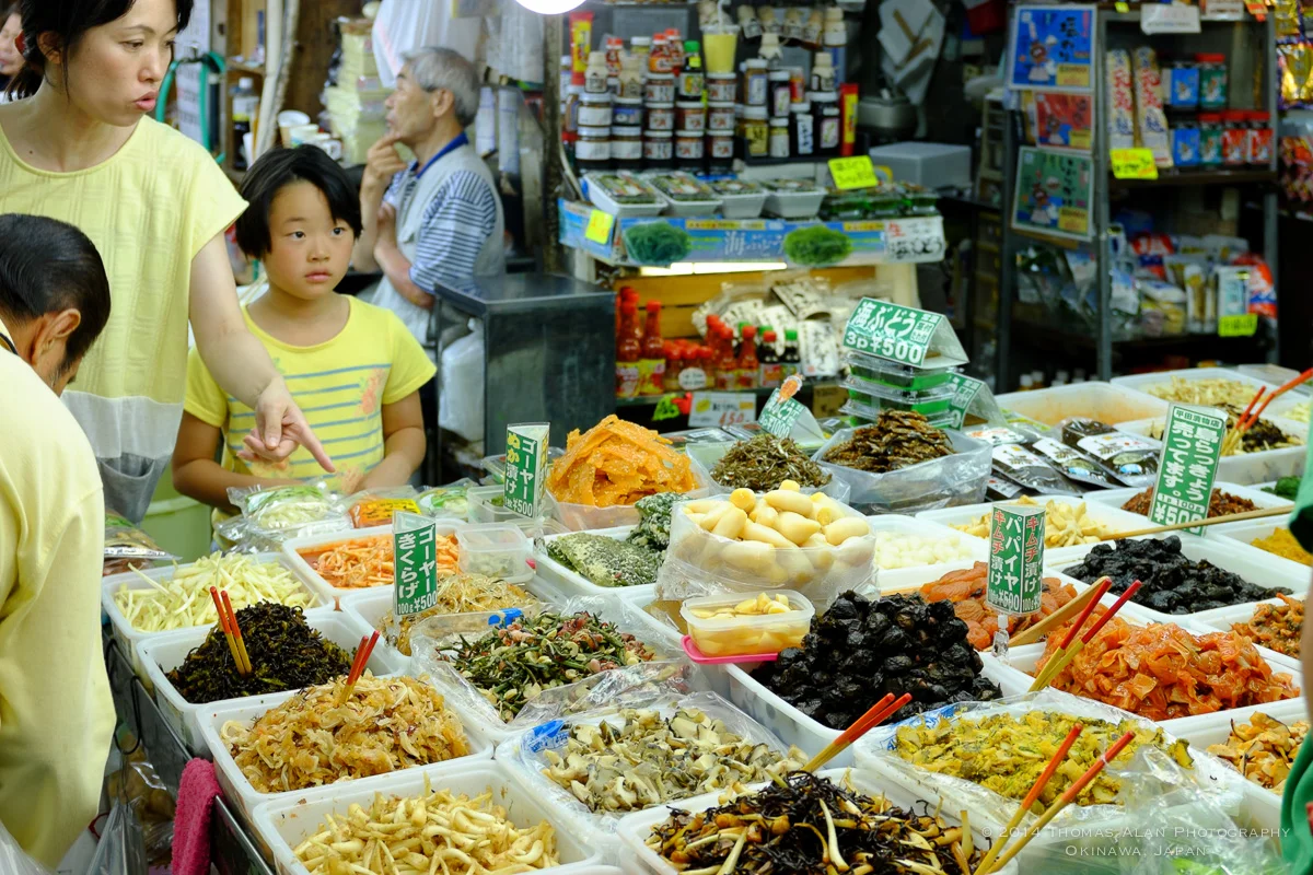 Naha Market. Fuji x100s with TCL-X100 Teleconverter Lens. SOOC with Fuji Velvia camera profile and Lens Correction applied. f/4, 1/100 sec, ISO 320.