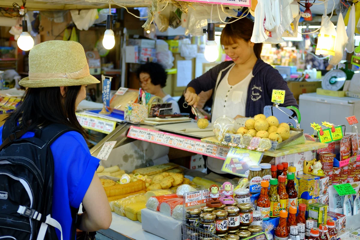 Naha Market. Fuji x100s with TCL-X100 Teleconverter Lens. SOOC with Fuji Velvia camera profile and Lens Correction applied. f/2.8, 1/100 sec, ISO 500.