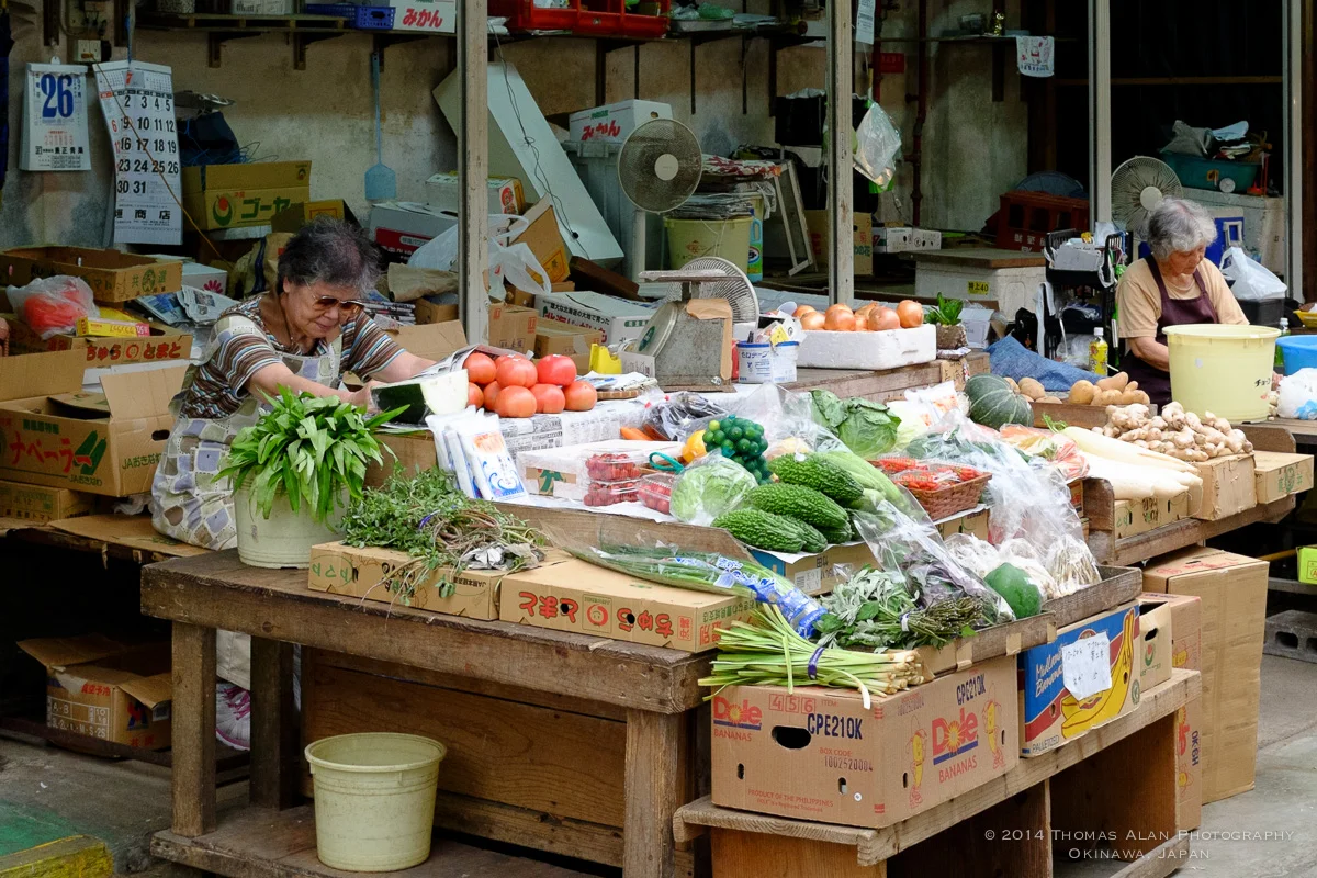 Naha Market. Fuji x100s with TCL-X100 Teleconverter Lens. SOOC with Fuji Velvia camera profile and Lens Correction applied. f/8, 1/250 sec, ISO 2500. Cropped in about 30%.