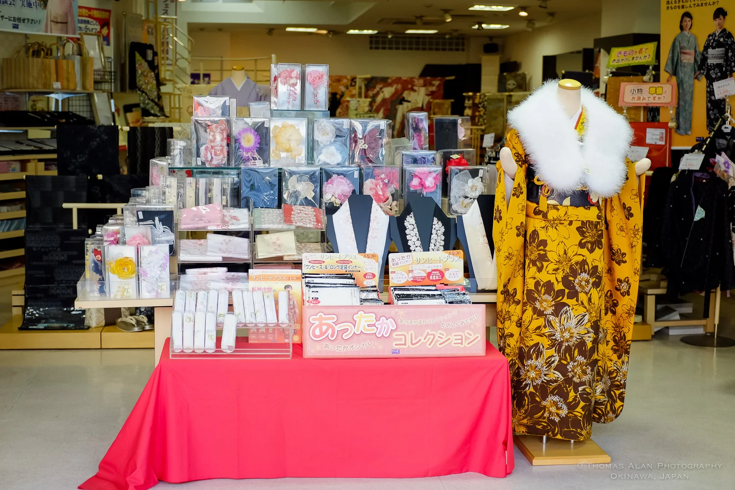 A kimono shop in Naha, Japan promoting items for Seigin-no-Hi, Coming of Age Day. Fuji x100s w/ TCL-X100.