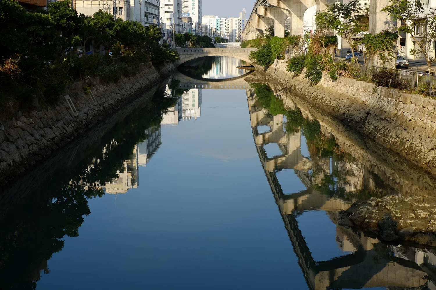 Reflections in the river. Naha, Okinawa, Japan. Fuji x100s w/ TCLx100 Teleconverter at ISO 200, f8, 1/220 sec.