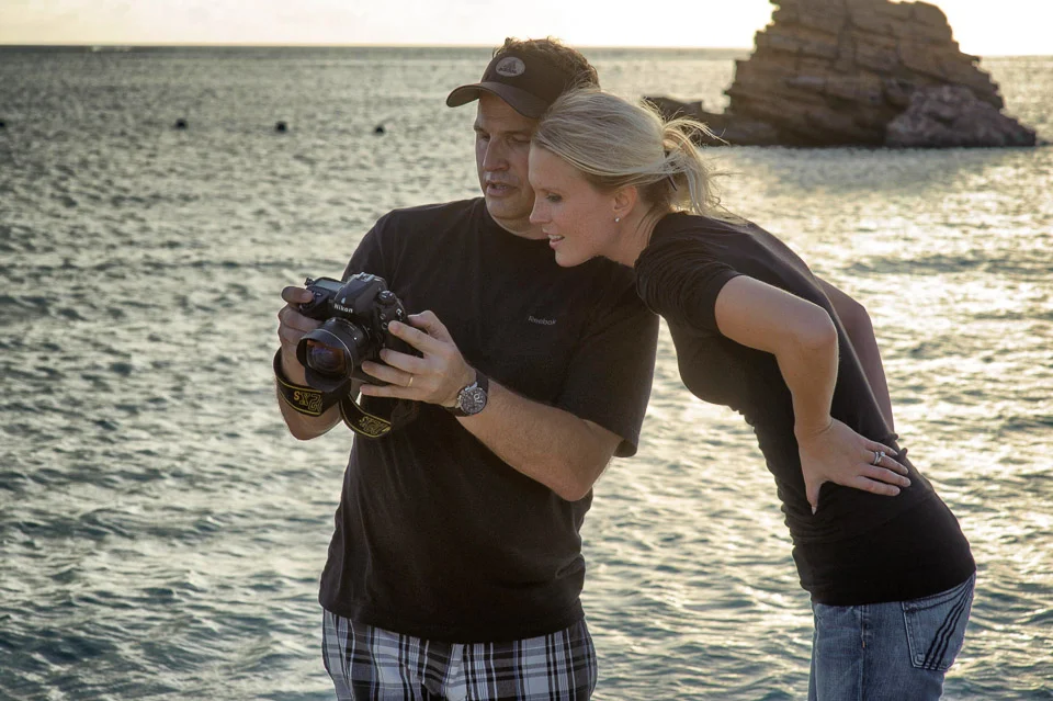 Before I started shooting with Fuji X-Series cameras. This is a behind the scenes shot from 2010 reviewing images with graphic artist Rachel V. at a U21 magazine shoot in Okinawa.