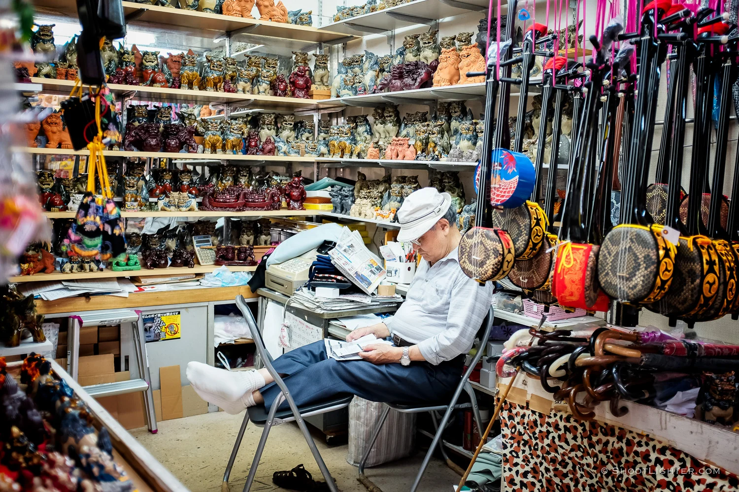 An Okinawan Sanshin 三線 shop keeper in Naha, Okinawa Japan. Fujifilm x100T, ISO 400, f/2.0, 1/80 sec, Fujifilm chrome film emulation, edited in Adobe Lightroom 6.