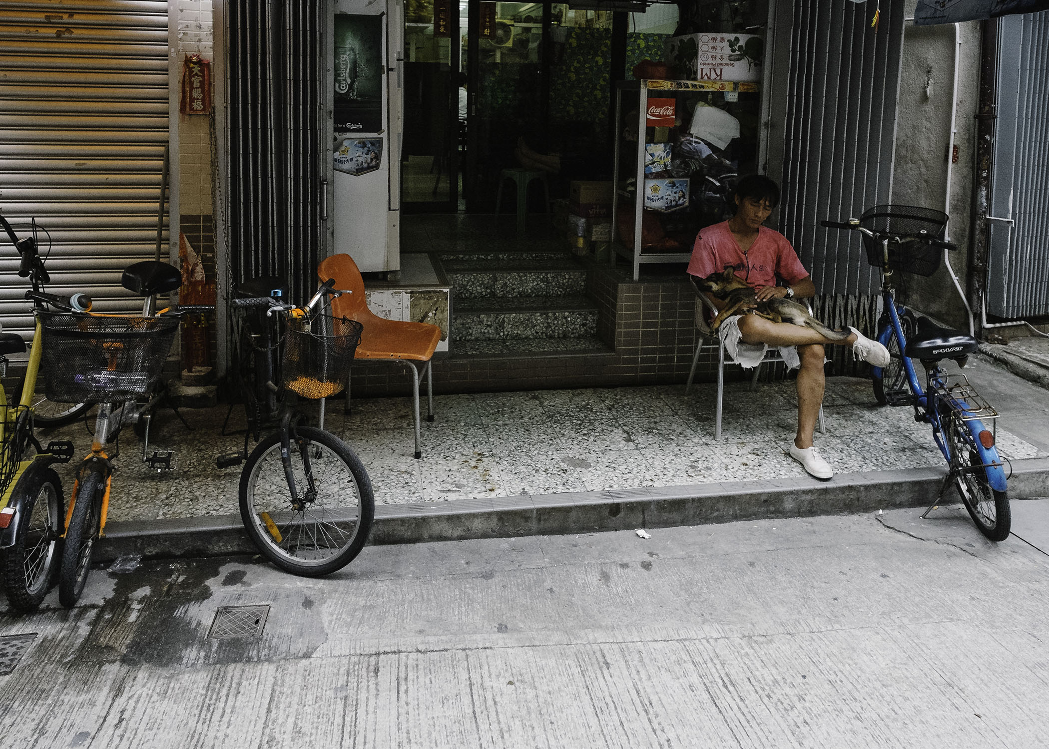 It's a safe town, keeping watch out side the shop