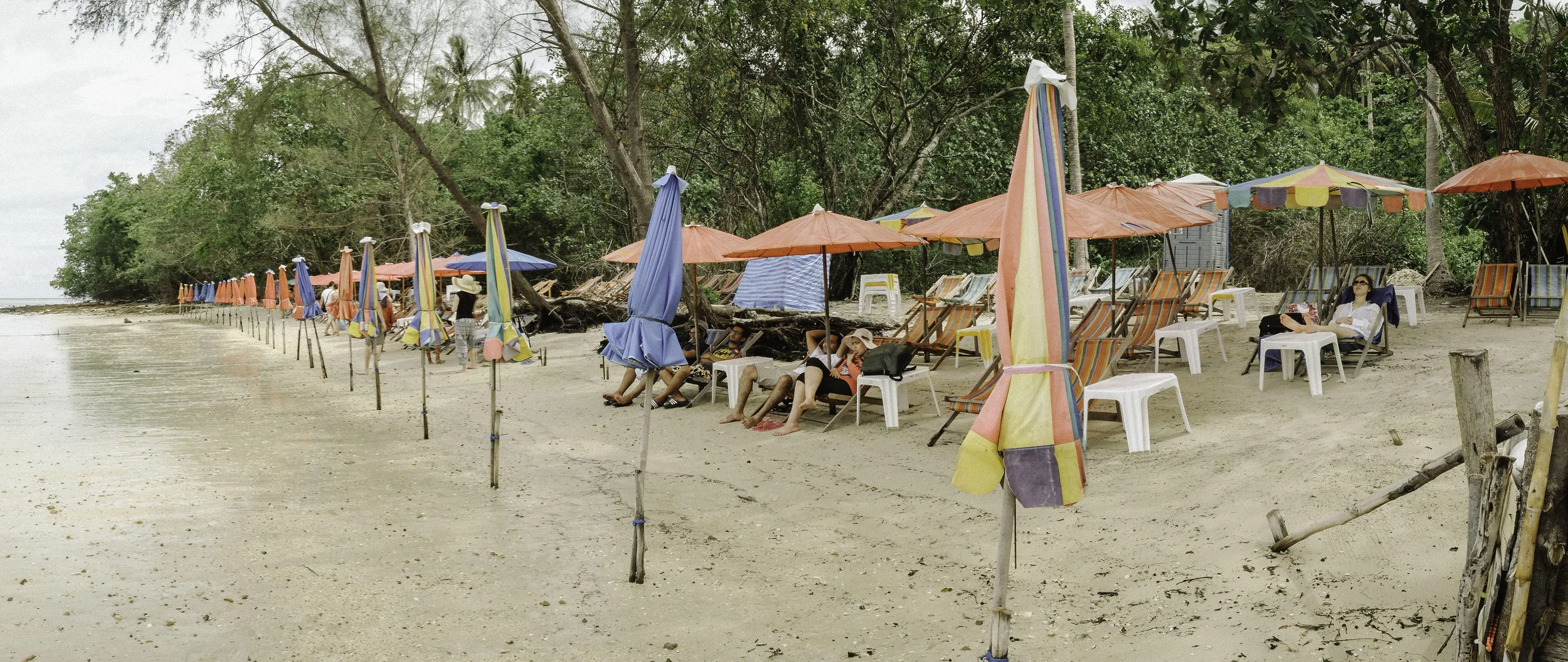 Lawa beach, there is really nothing here. The tour group basically has their own setup where you can hire a jet ski or canoe and buy drinks