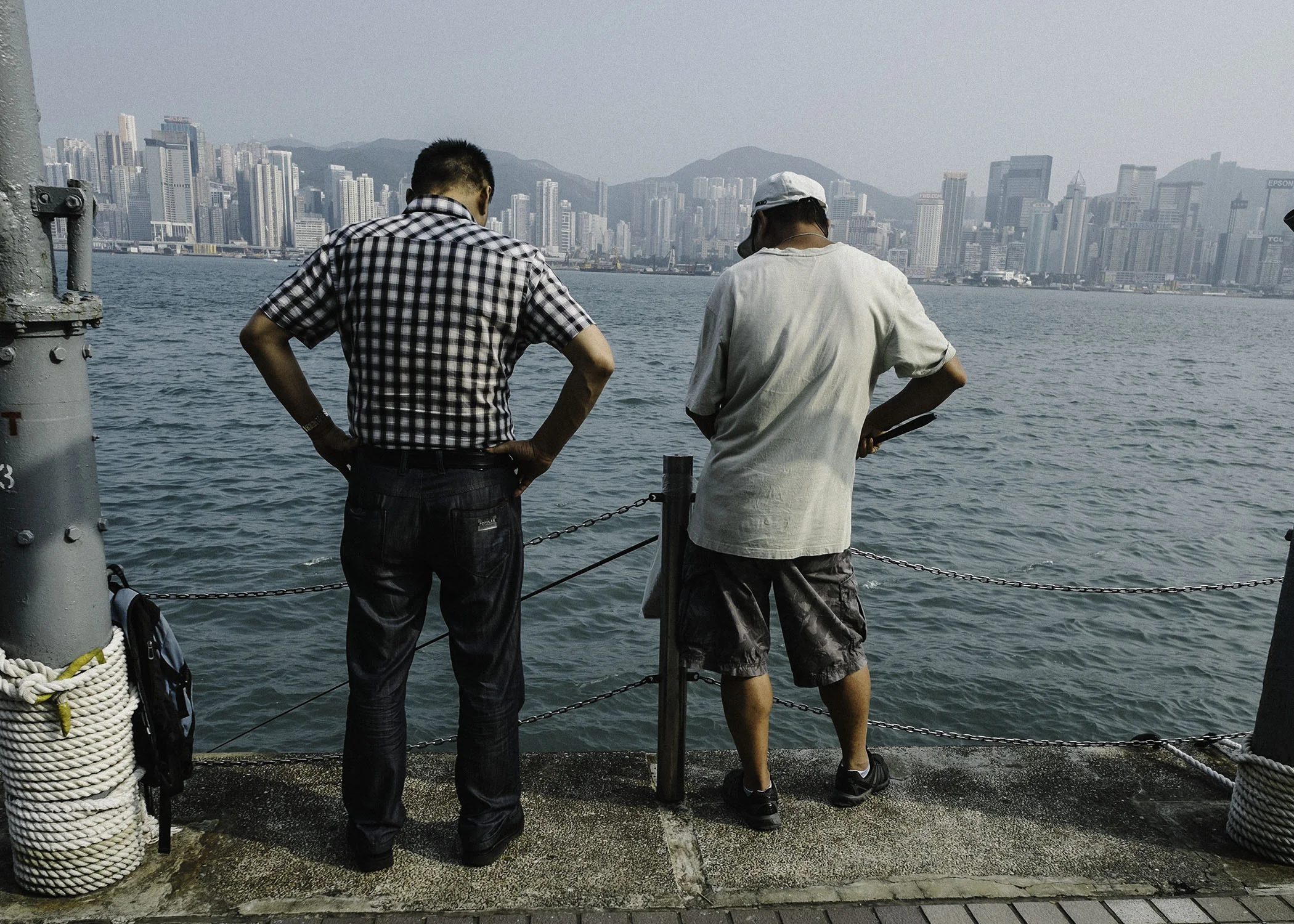 Tsim Sha Tsui Promenade.. are they fishing or talking business, like those HK cop movies ?