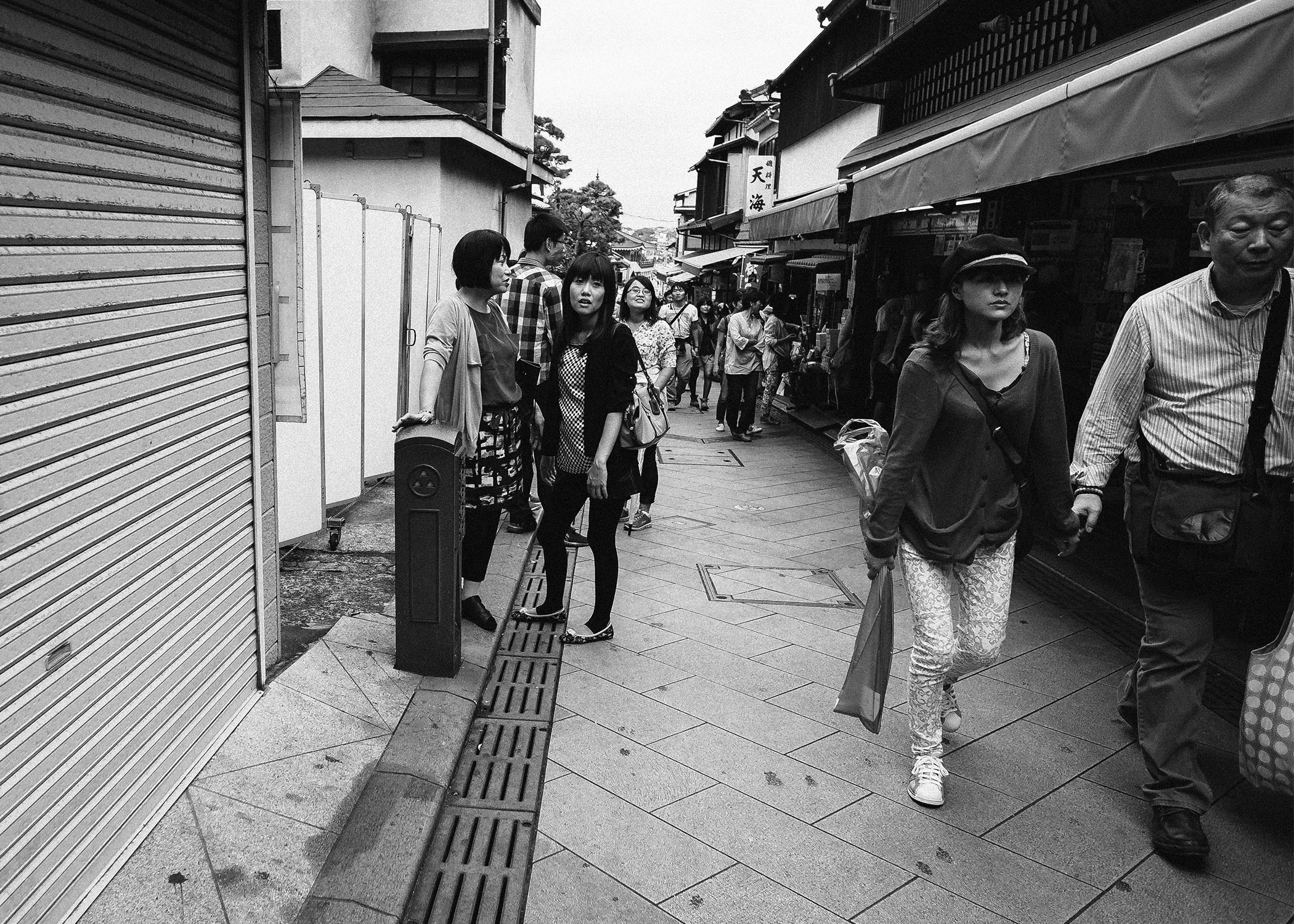 Locals on the way to the shrine. It is a bit of a walk up, some take a breather