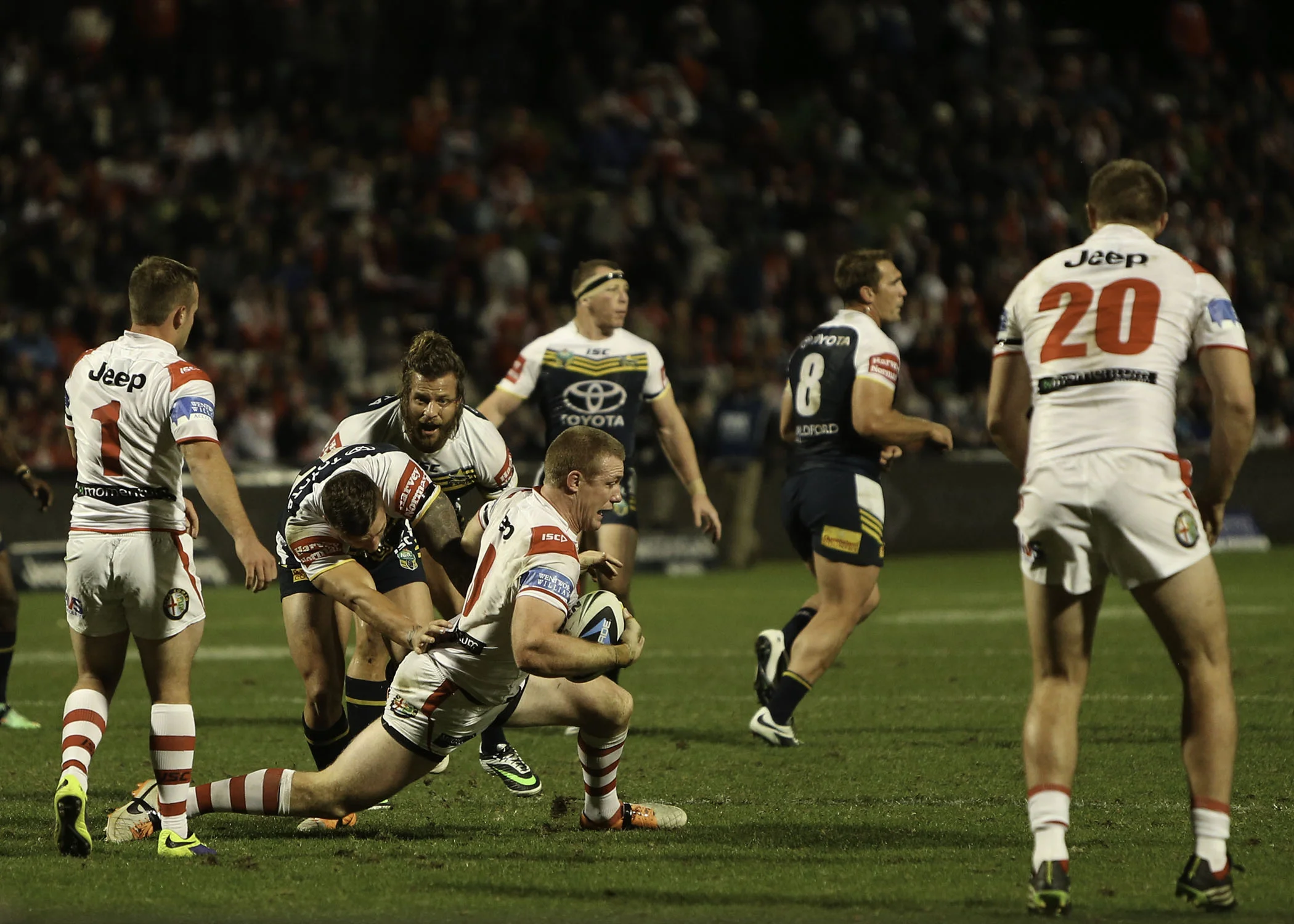 Captain Creagh CRUNCHED .. the Sims brothers, Tariq and Ashton snash their former junior team mate straight after the kick off
