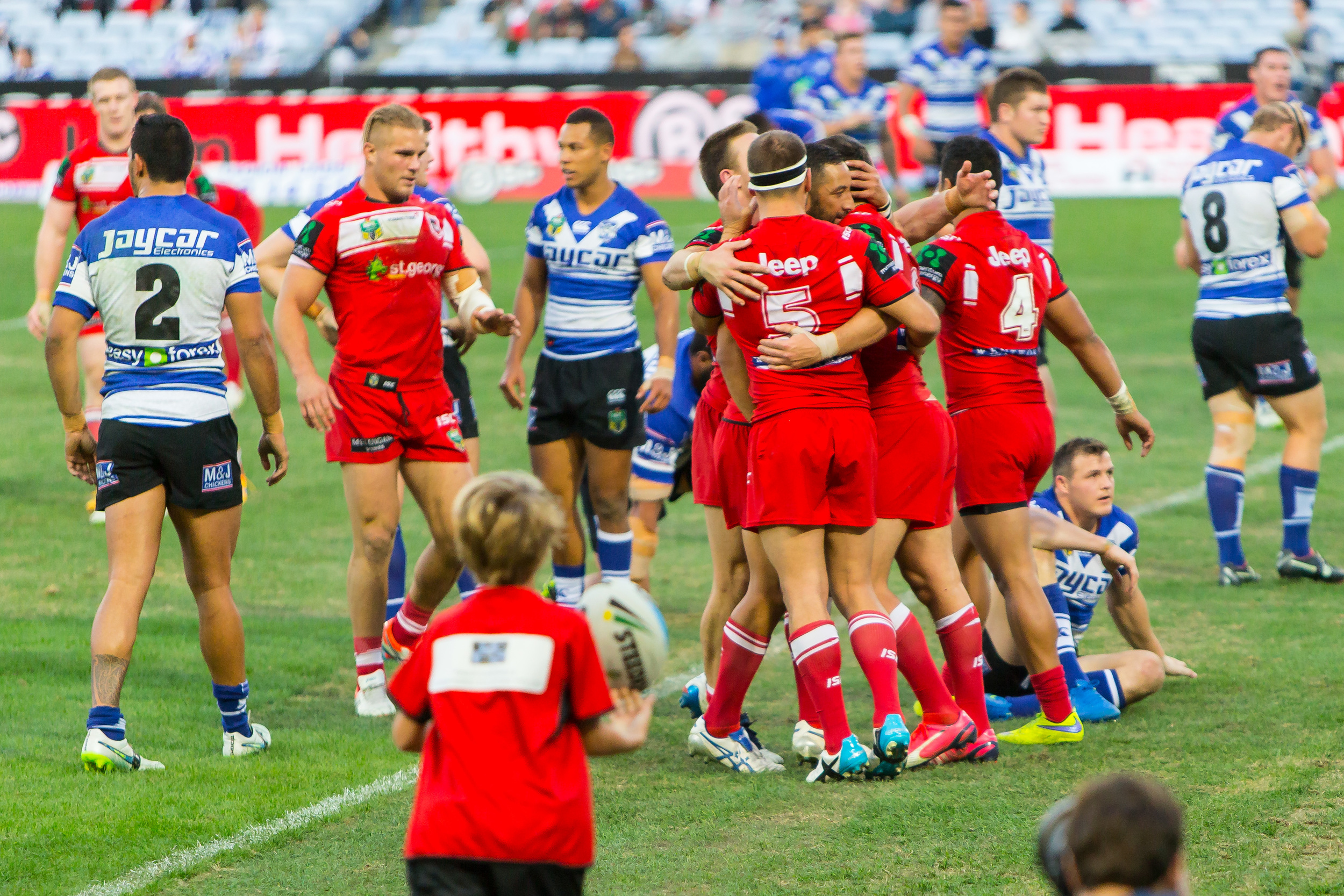 The halves share a hug