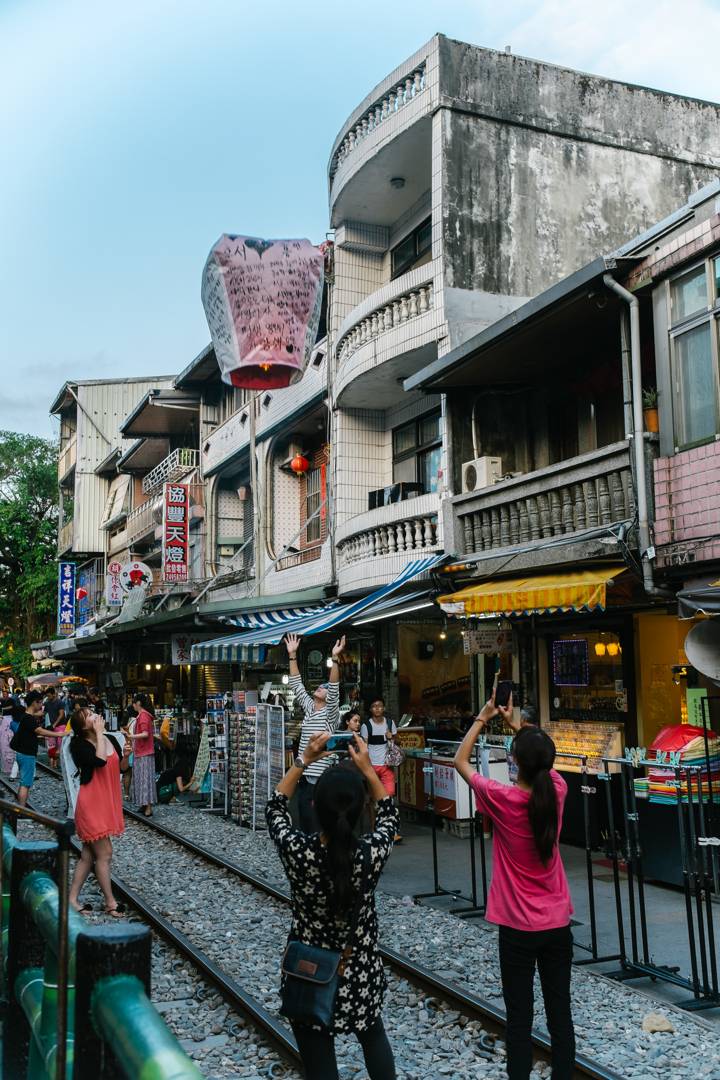 People watching their lanterns fly in the sky