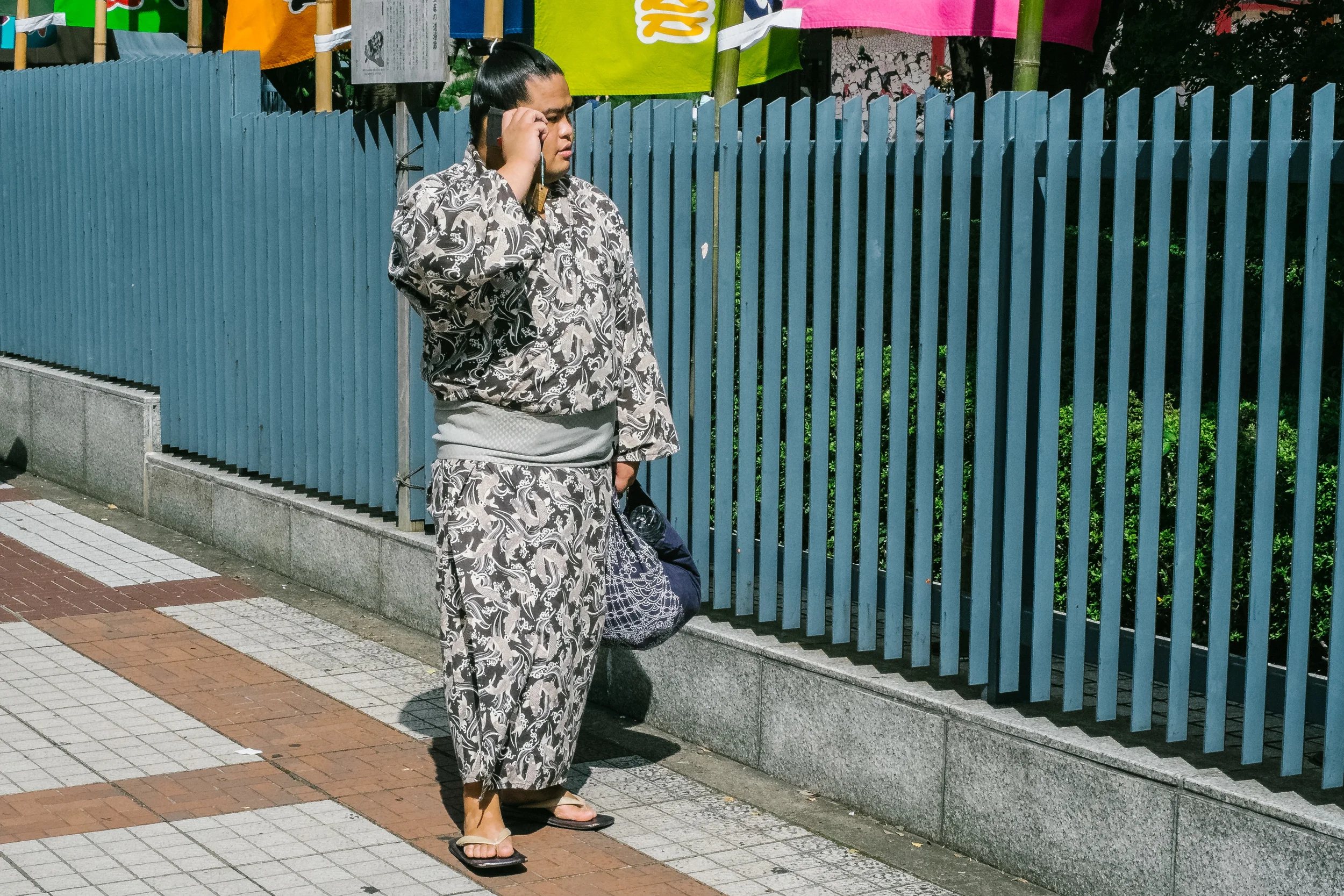 Sumo's generally make their own way to the stadium, this one is getting last minute tips on the phone