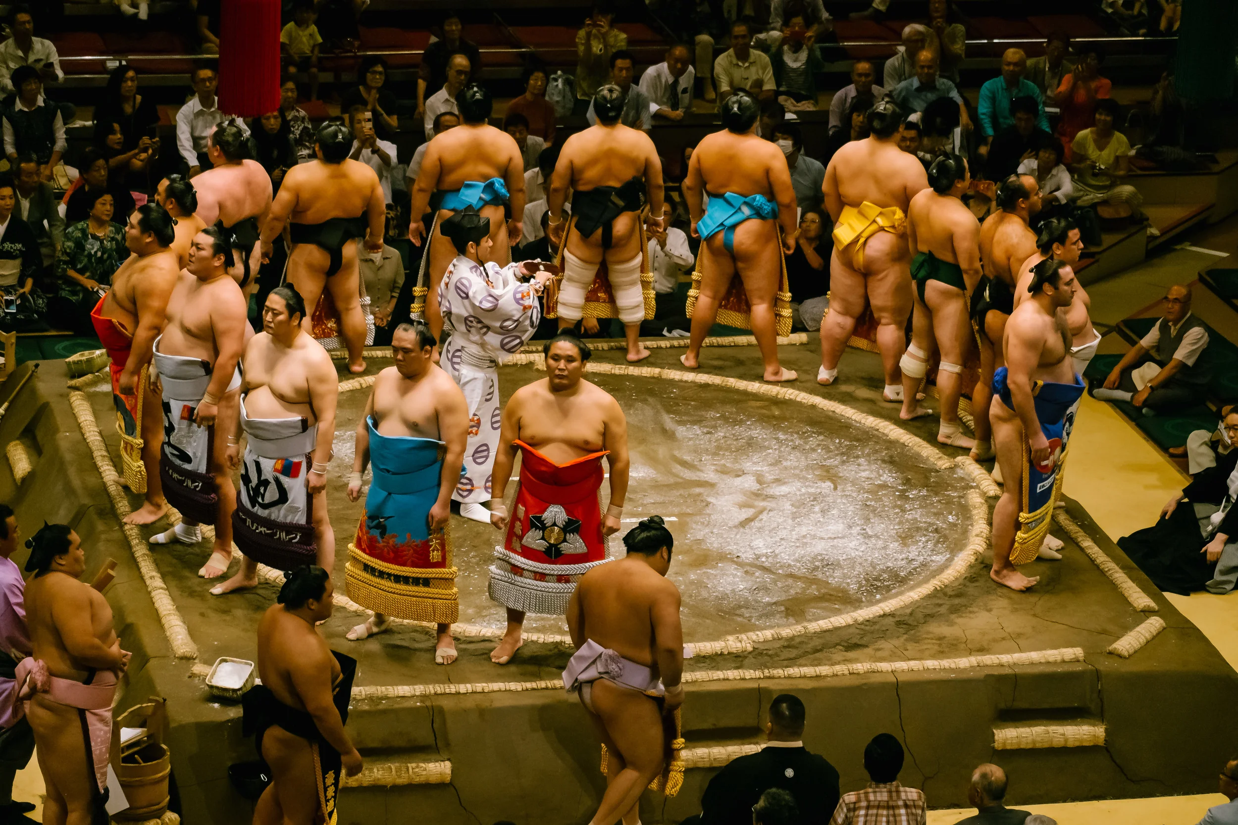 Each Sumo is introduced one at a time to enter the ring