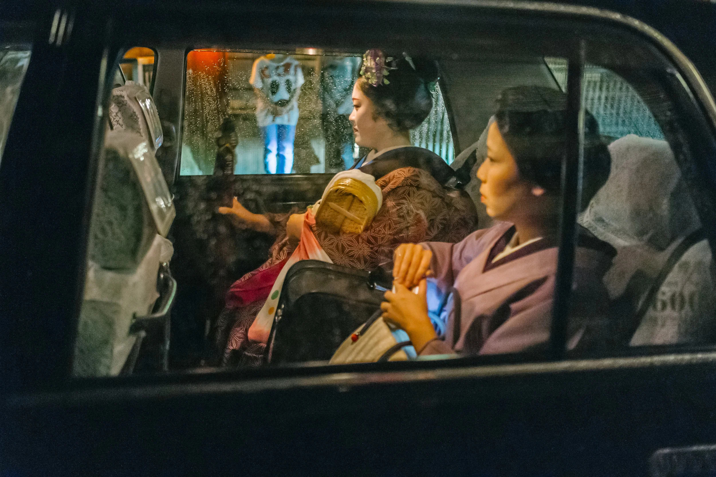 Found a Geisha, just left the tea house and in to the taxi, with an apprentice?