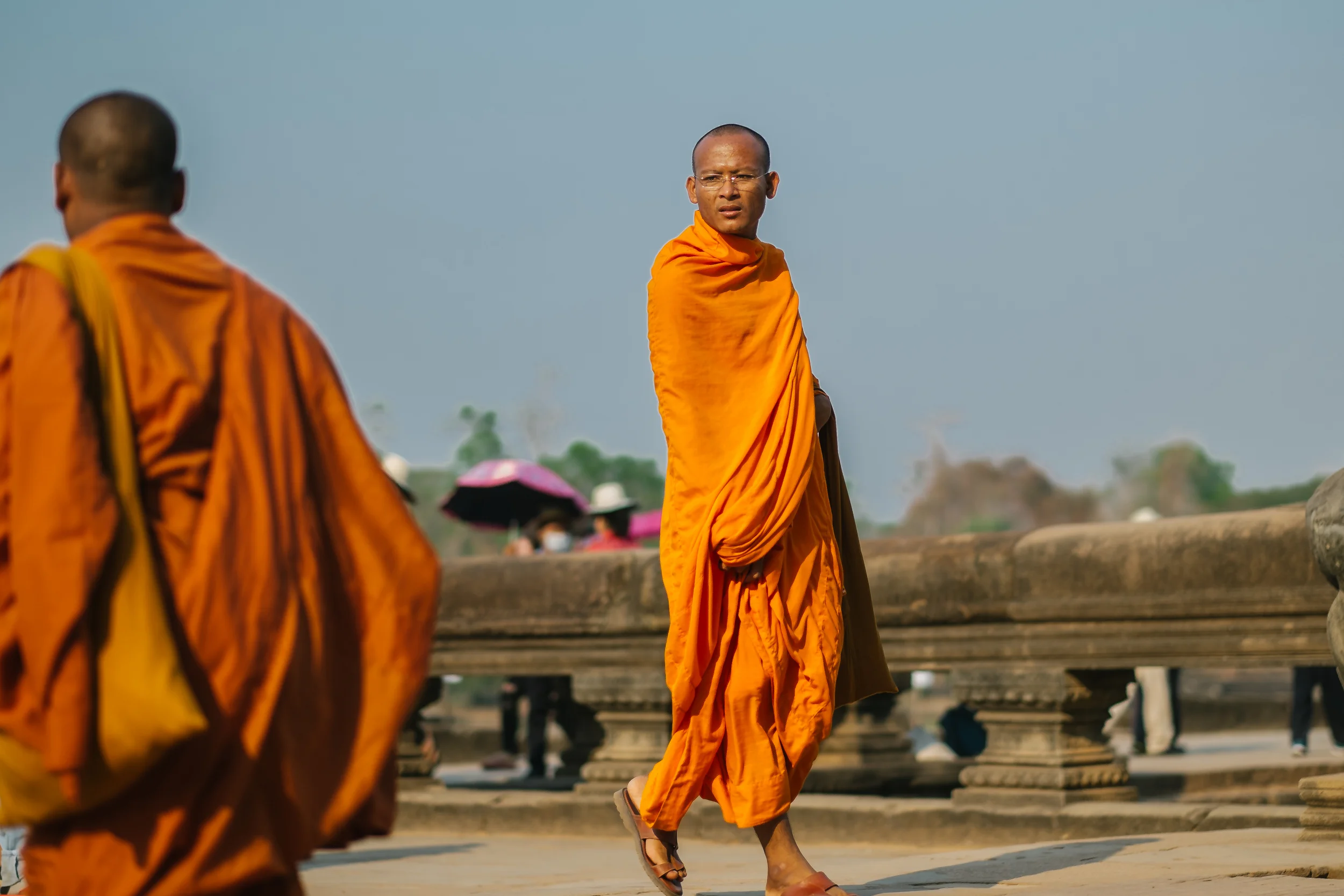 Buddhist monk leaving Angkor Wat. Fuji X-Pro 1, 56mm f/1.2 R