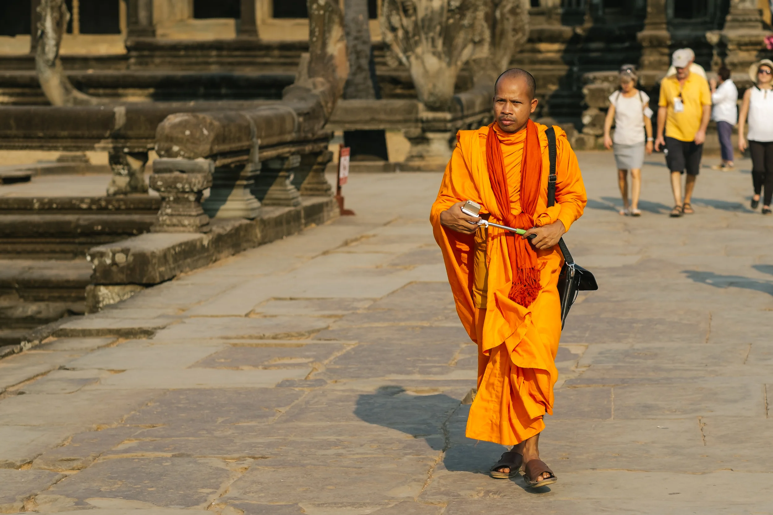Buddhist monk also fascinated by Angkor Wat and is prepared with his selfie stick. Fuji X-Pro 1, 56mm f/1.2 R