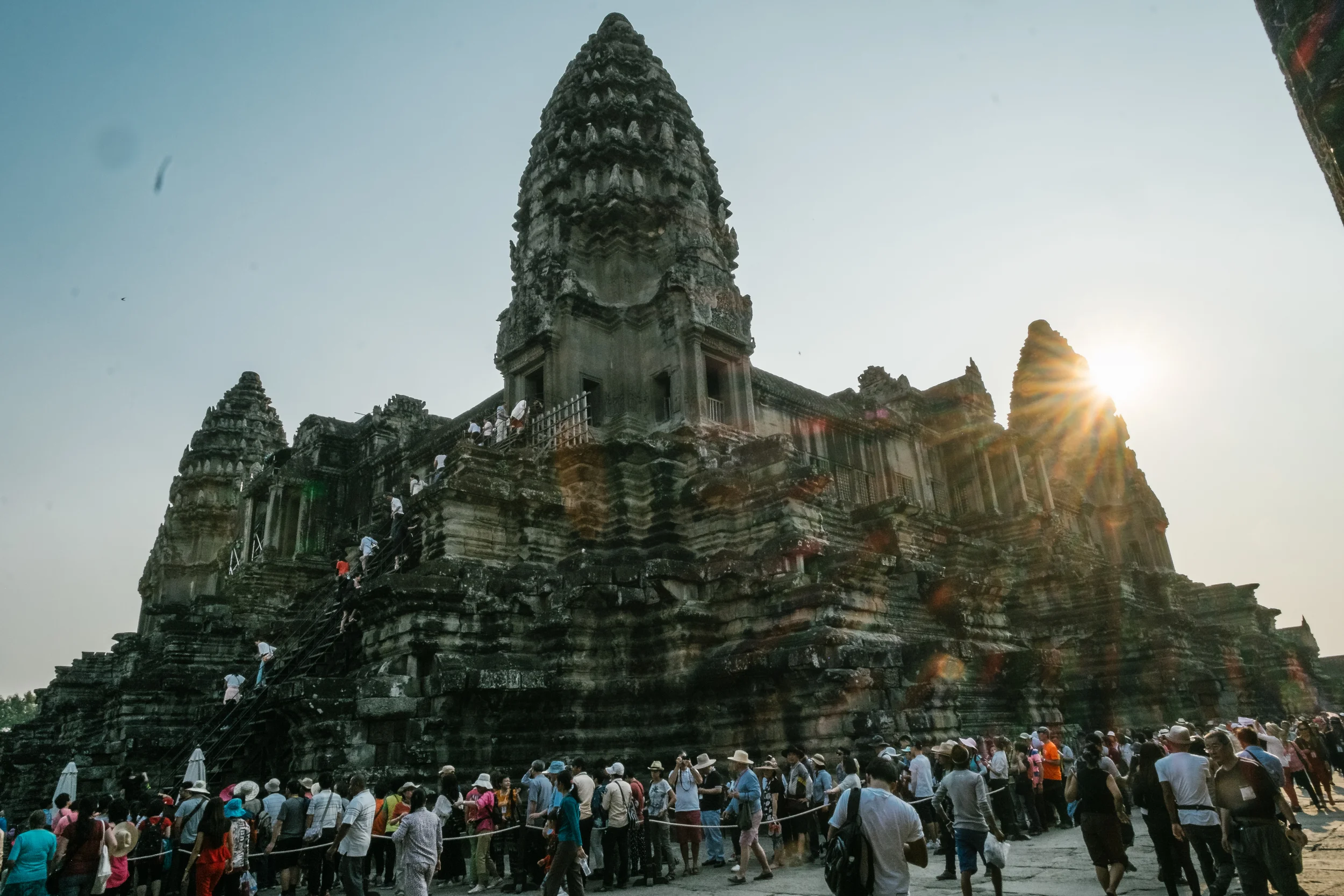 People queuing late in the day to get up one of the towers of Angkor Wat. Fuji X-Pro 1, 14mm f/2.8