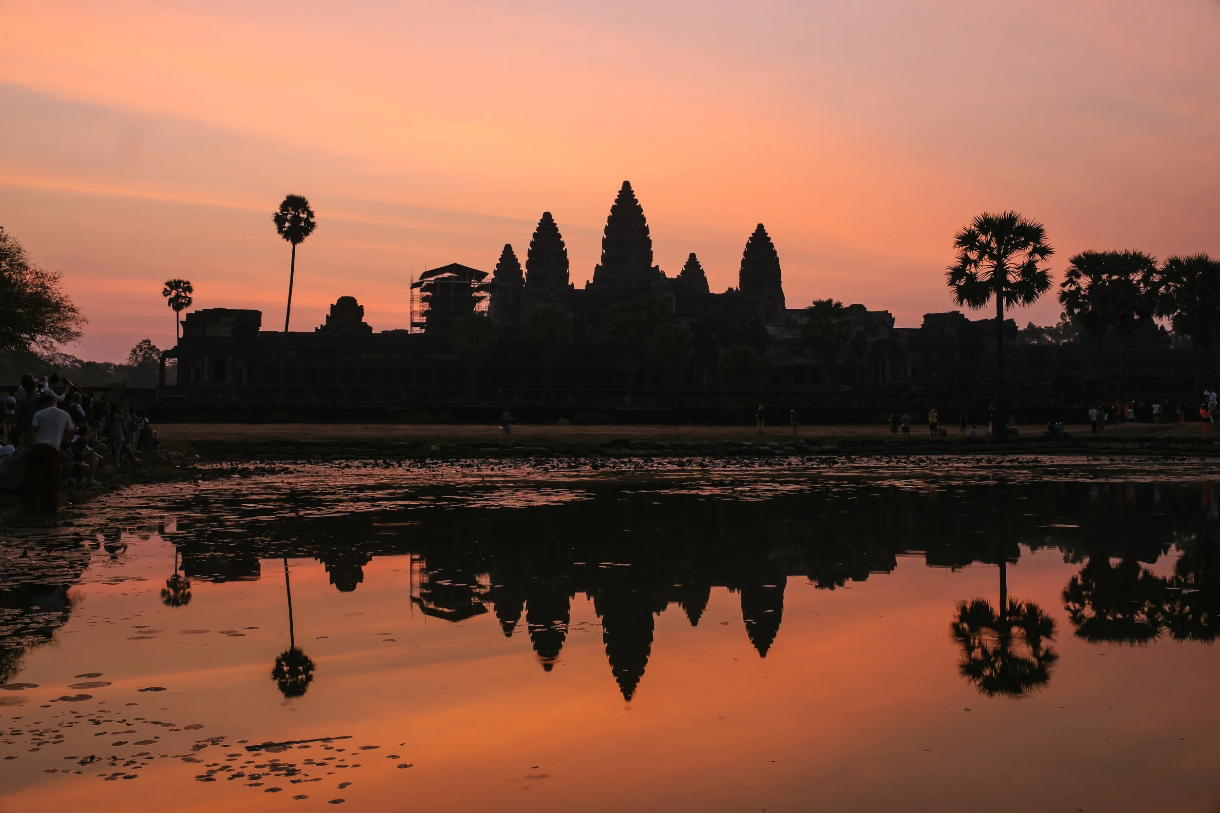 Sunrise at the magnificent Angkor Wat. The strange thing is that after you get the bright orange and blue skies, once the sun is almost up you get a grey haze.&nbsp;Fuji X-Pro 1, 23mm f/1.4&nbsp;