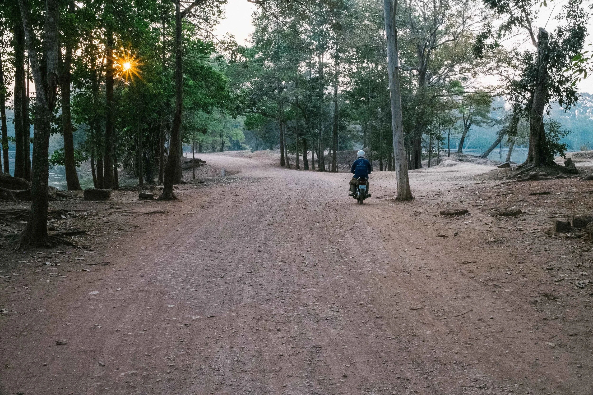 We didn't wait for the fireball sun appear behind Angkor Wat as it would ruin the scheduling of the other temples. I grabbed pretty much what I wanted, so it was off to the next temple.&nbsp;Fuji X-Pro 1, 23mm f/1.4