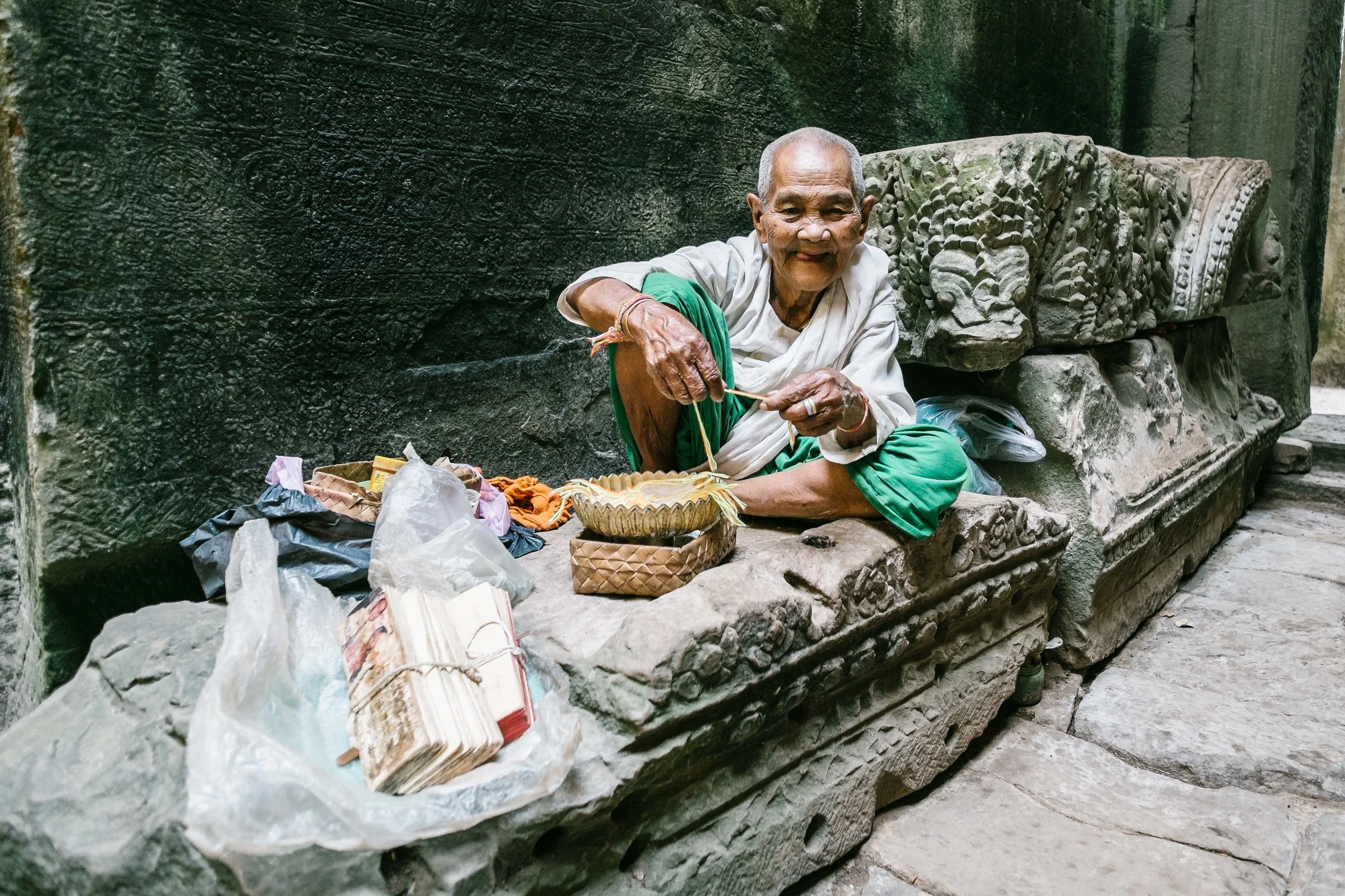 An old gentlemen with a book of wishes and bands for good luck.&nbsp;Fuji X-Pro 1, 14mm f/2.8