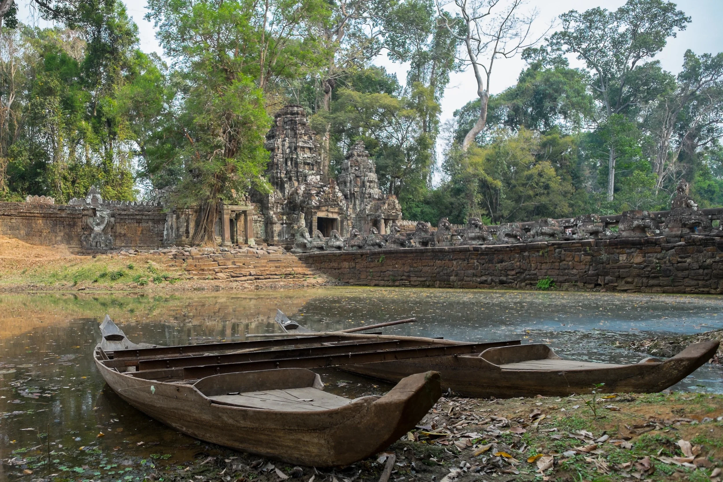 A pair of fisherman boats on the outside. The moat seems to have gone through a drought in the dry season.&nbsp; Fuji X-Pro 1, 14  mm f/2.8