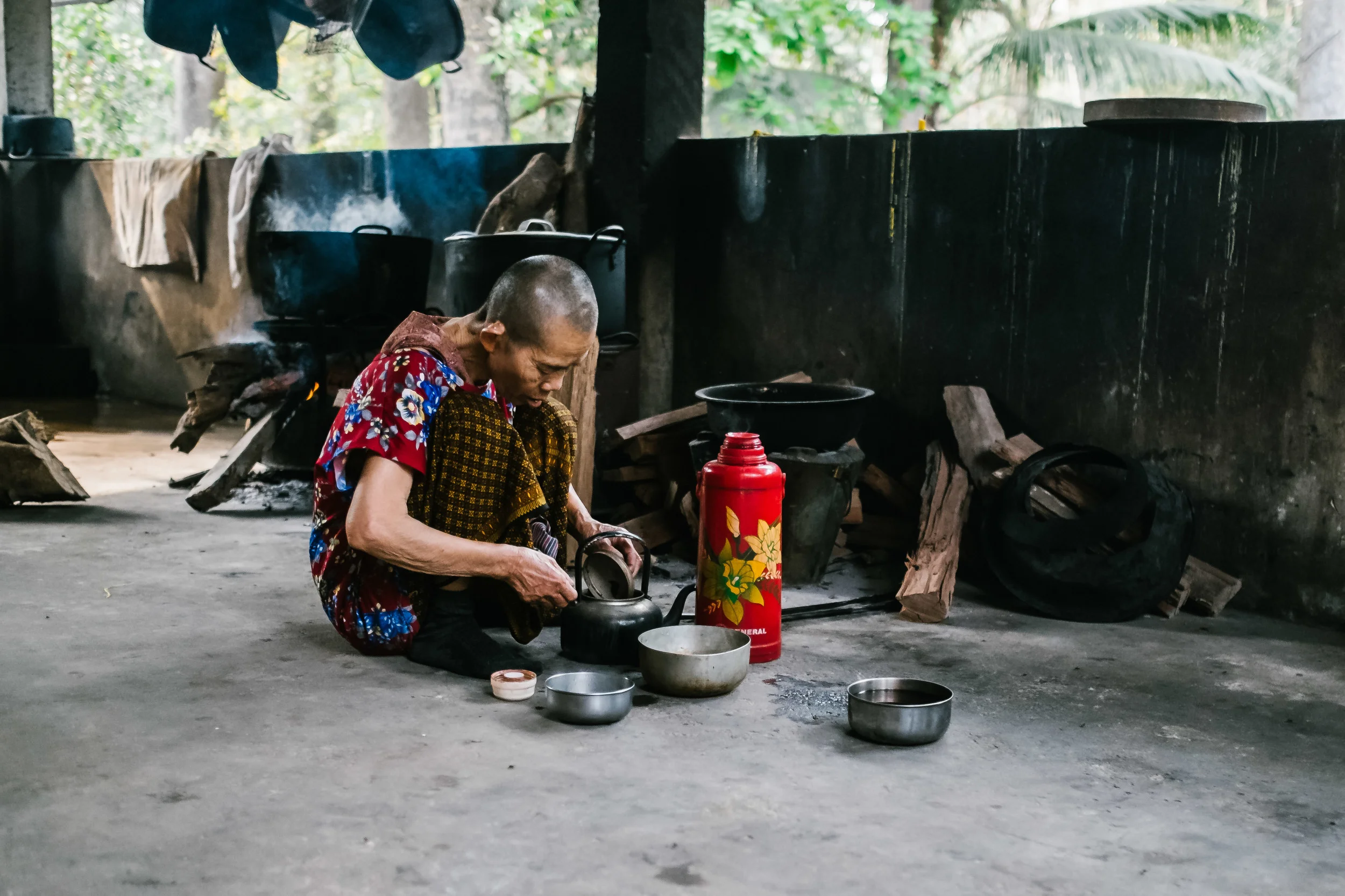 An old lady within the temple making some traditional medicine  Fuji X-Pro 1, 23mm f/1.4