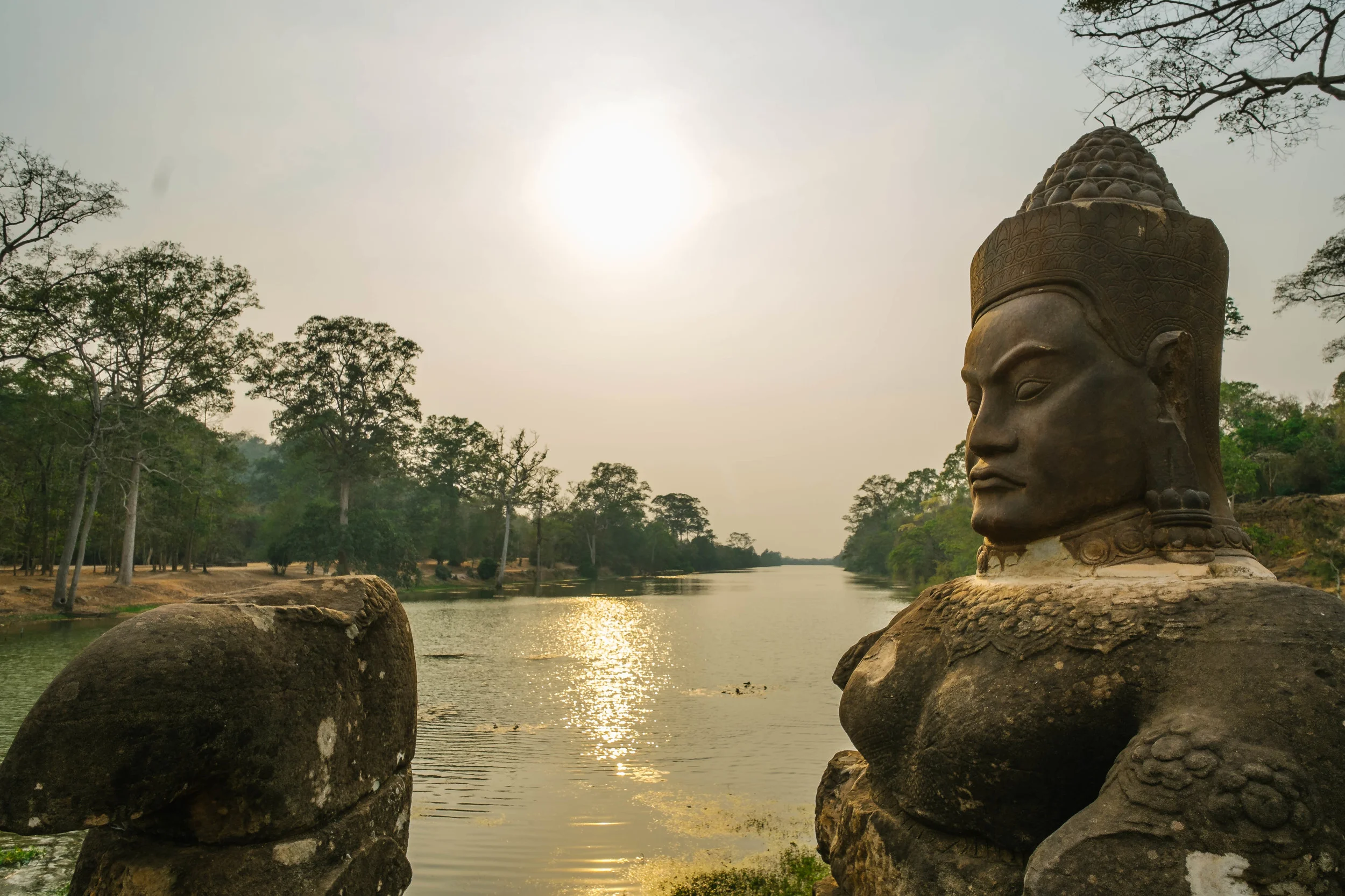Decided to stop over and walk the bridge. The bridge has two sides one side of happy faces the other side of not so happy. The river has some skinny buffalos down below grazing on the grass