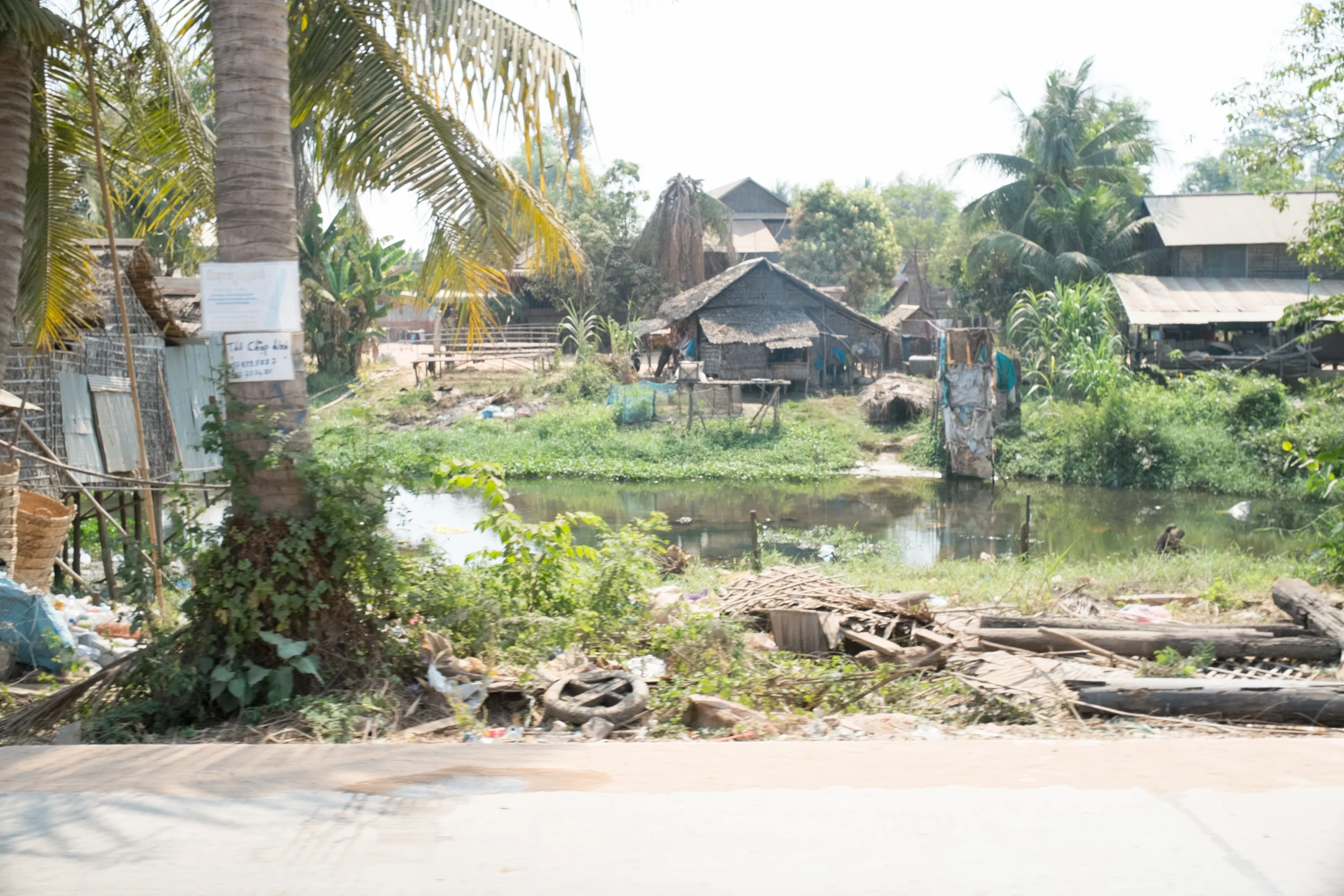 Houses along the river on the way to Tonie Sap Lake. Fuji X-Pro 1, 23mm f/1.4