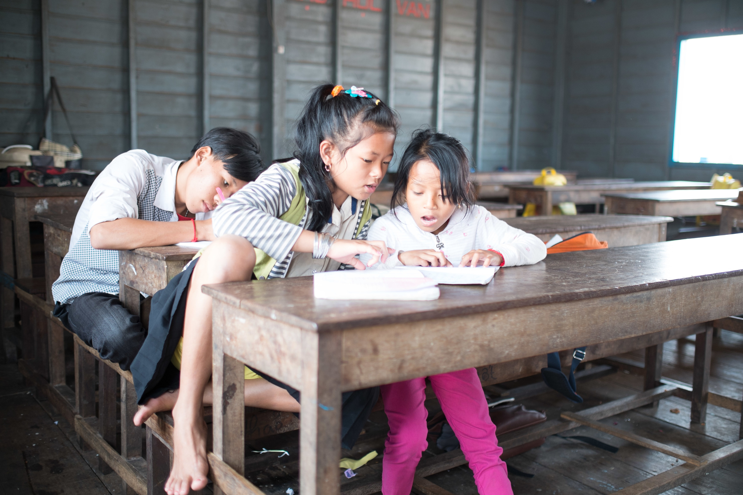 Some kids after their lunch are at the books. Fuji X-Pro 1, 23mm f/1.4