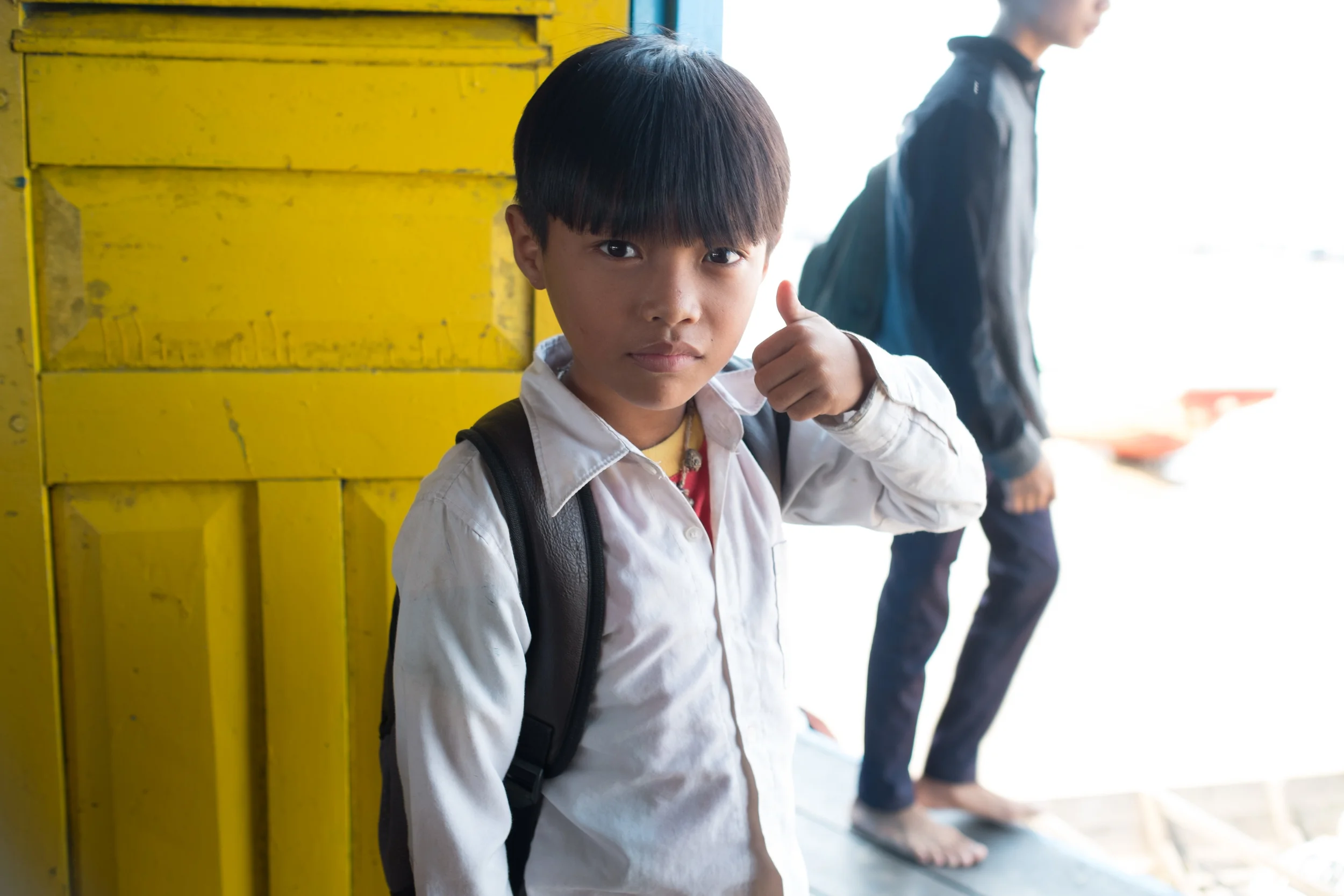 Some kids just want to wander around on the boat in their lunch break. He is waiting his turn to go and have some fun. Fuji X-Pro 1, 23mm f/1.4