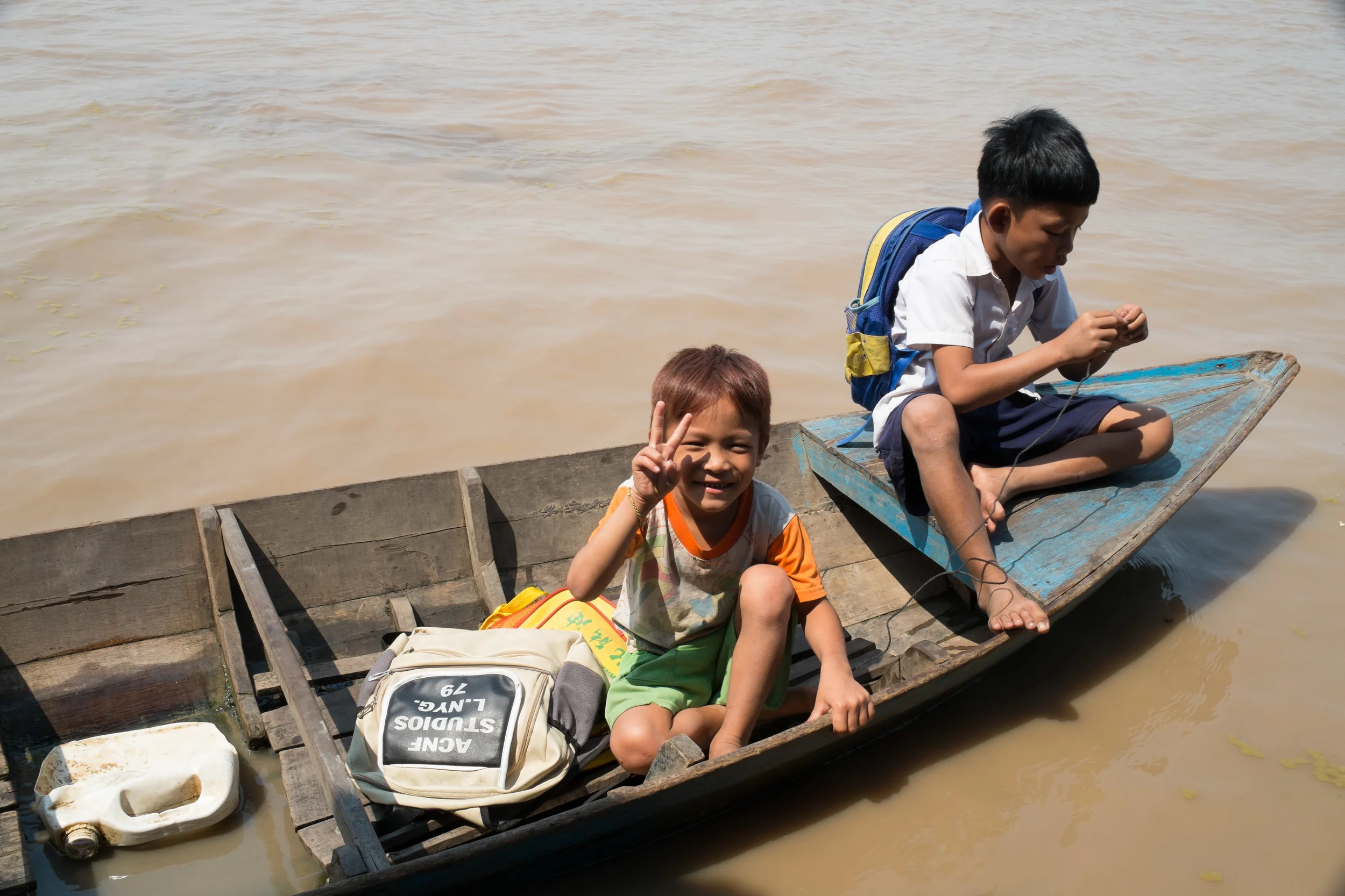 These kids are taking a ride on the boat before school starts again. Fuji X-Pro 1, 23mm f/1.4