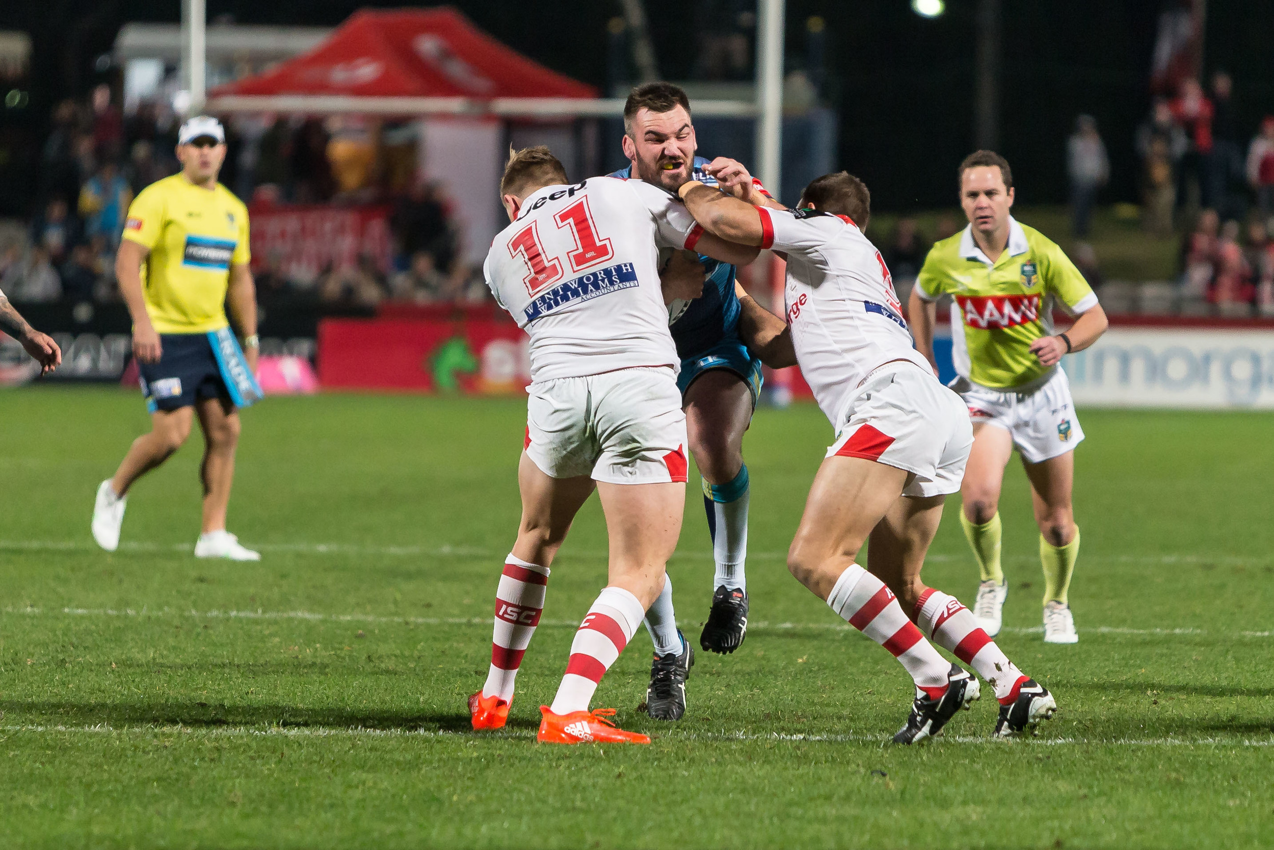 Luke Douglas charges forward for the TItans in good field position