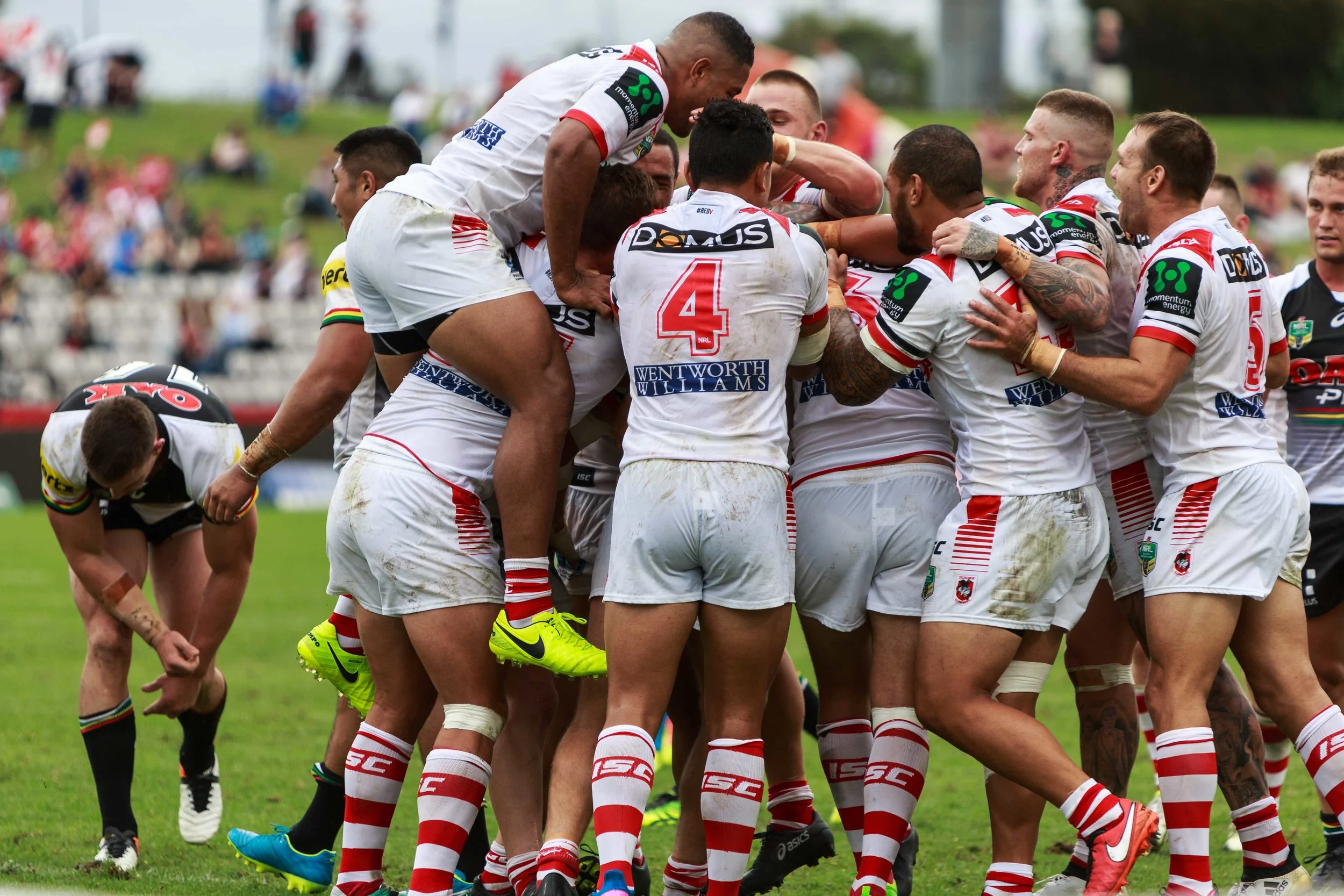 Celebrations all around the try scorer de Belin, but he is no where to be seen