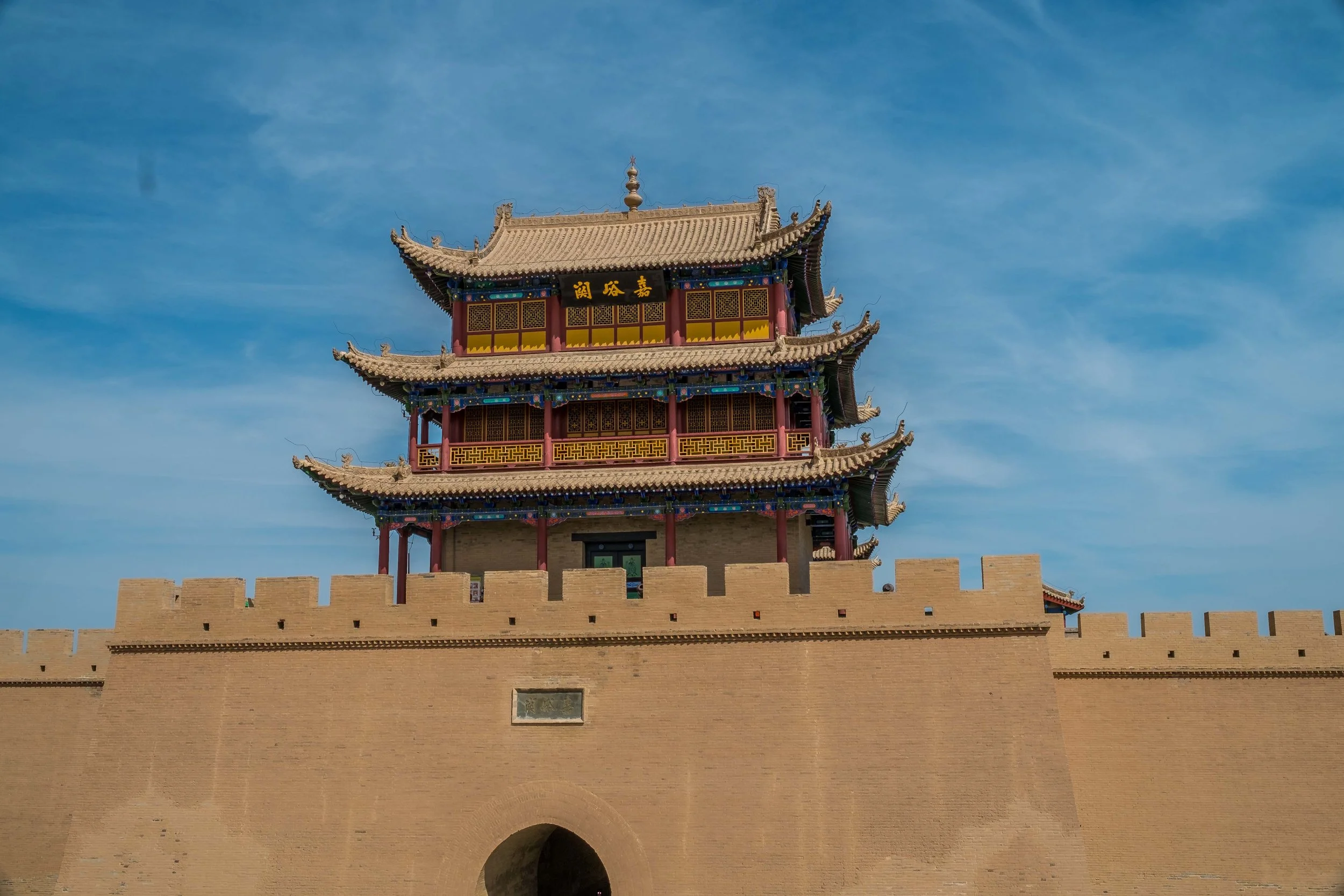 Apparently those 3 letters in calligraphy are written by the Emperor himself