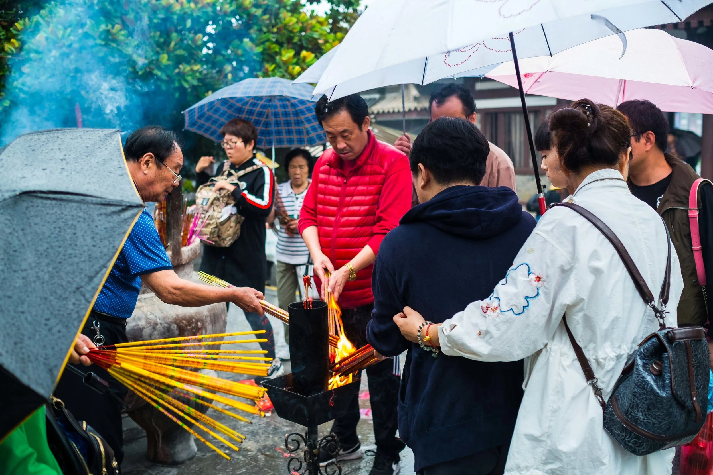 People queuing to burn incense