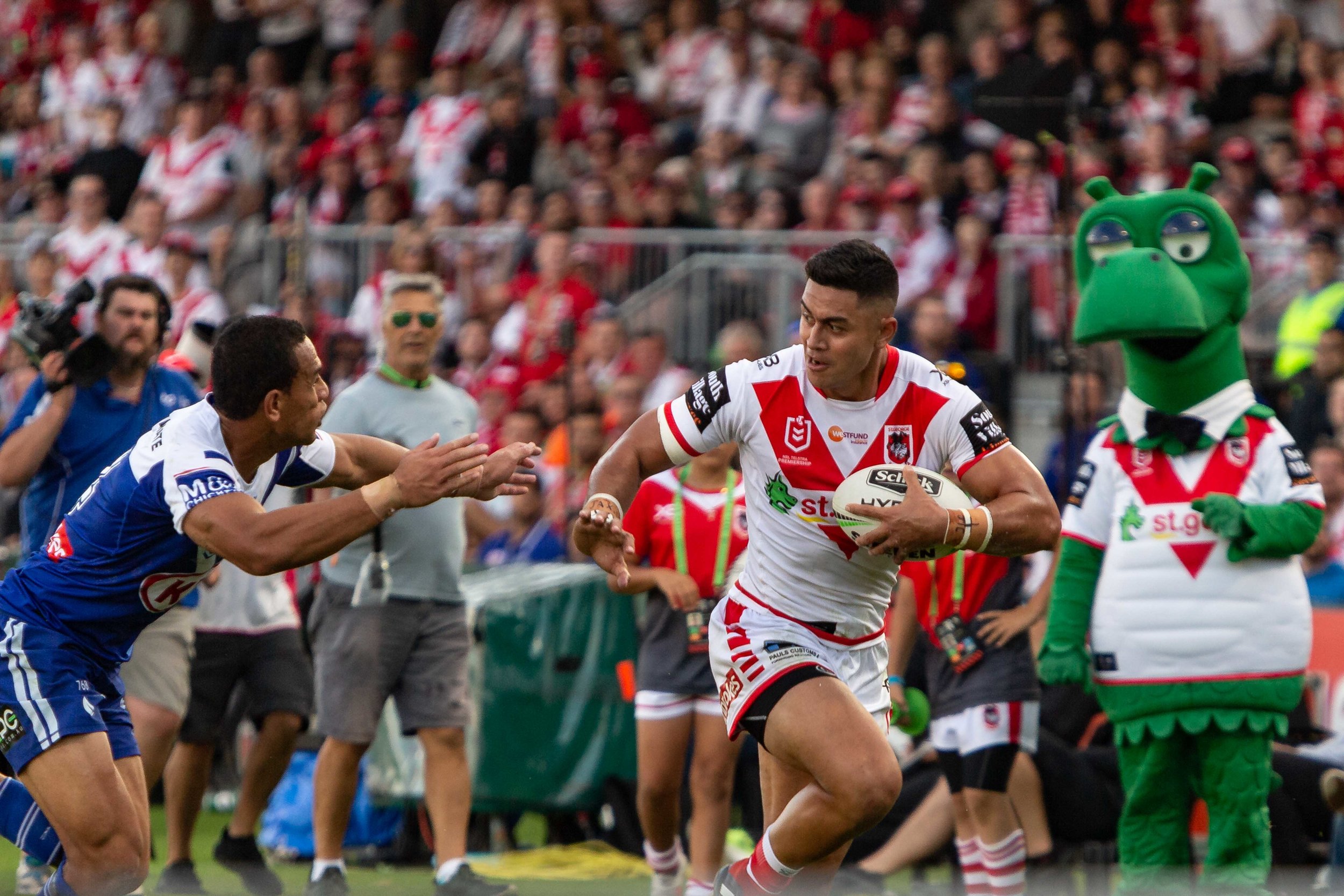 Lafai brushes Hopoate away for a try