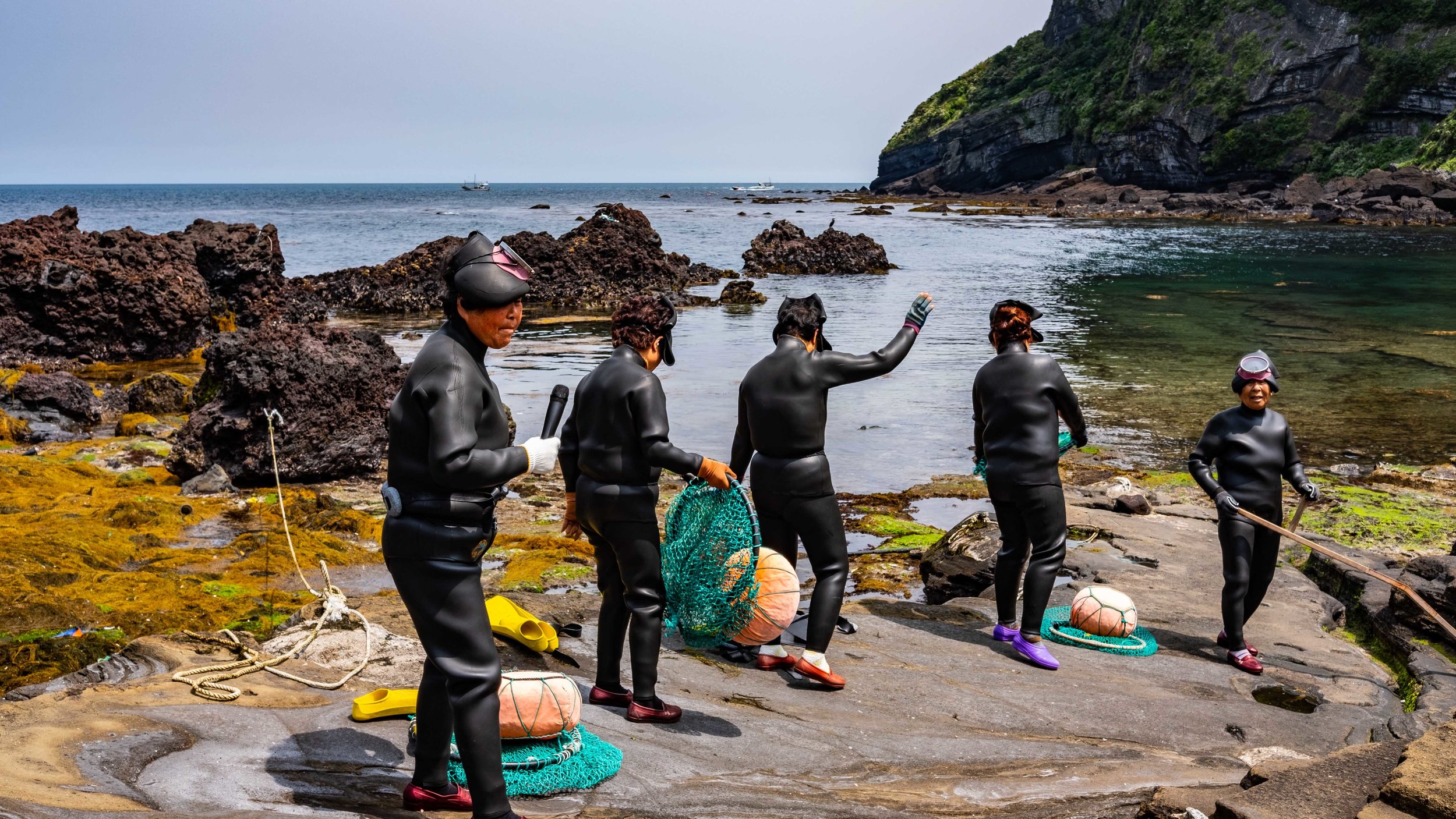 Haenyeo, female divers who make up the culture of Jeju Island. Often are responsible for the local abalone sales