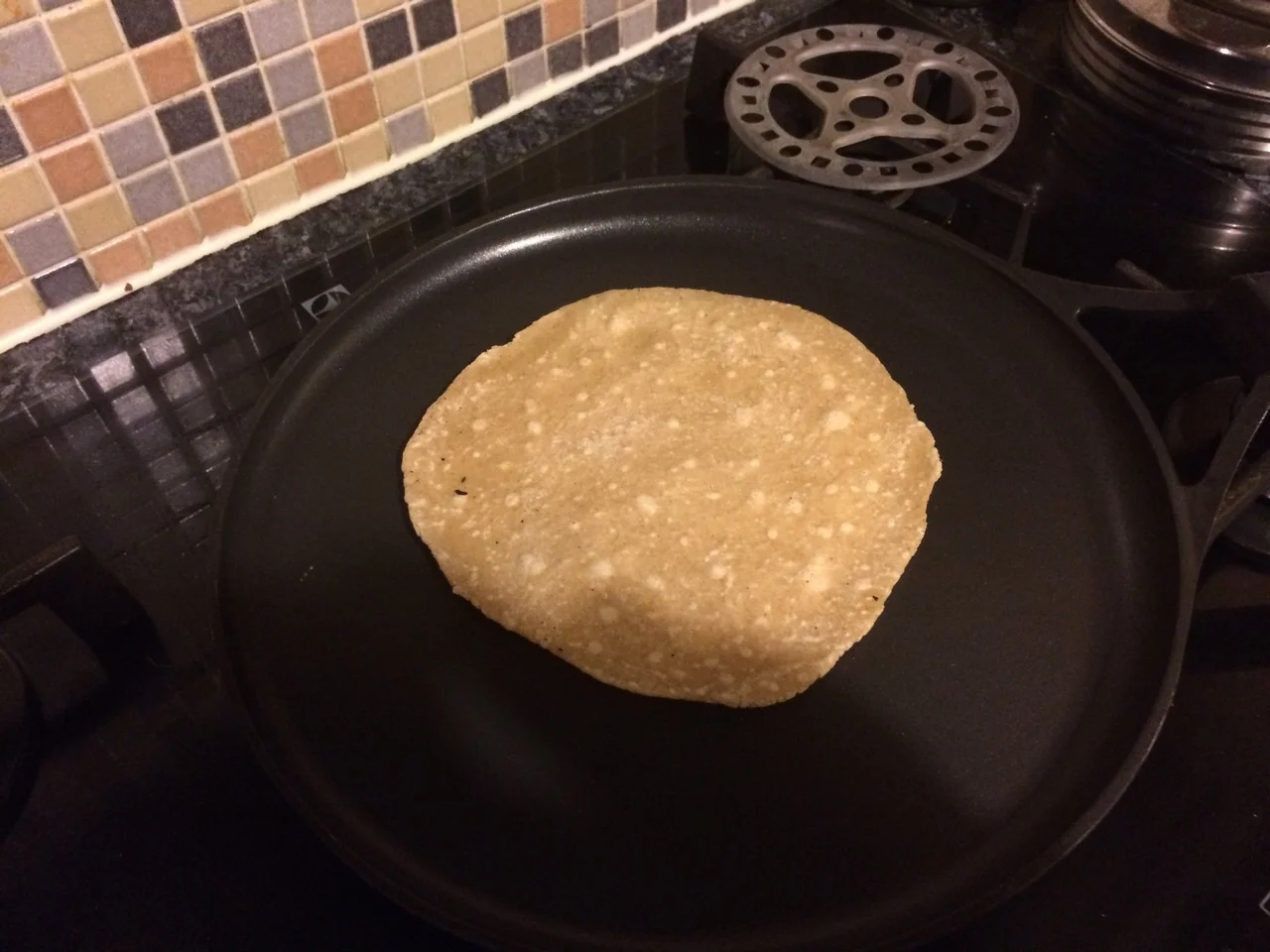 Flip over after a few seconds. The other side will start to have bubbles forming. You can continue like this and keep flipping on the pan until cooked
