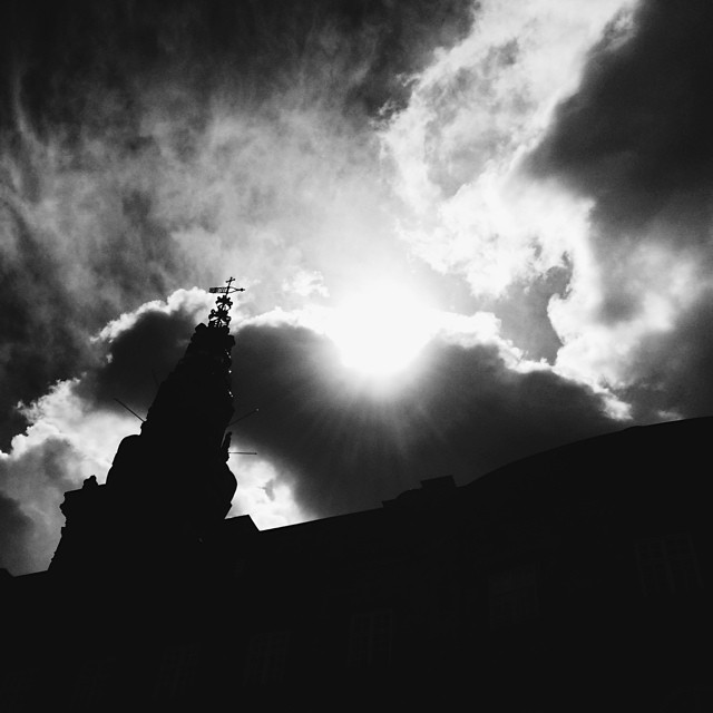 Dramatic burst of #sunlight behind #parliament - #blackandwhite #christiansborg #copenhagen #clouds