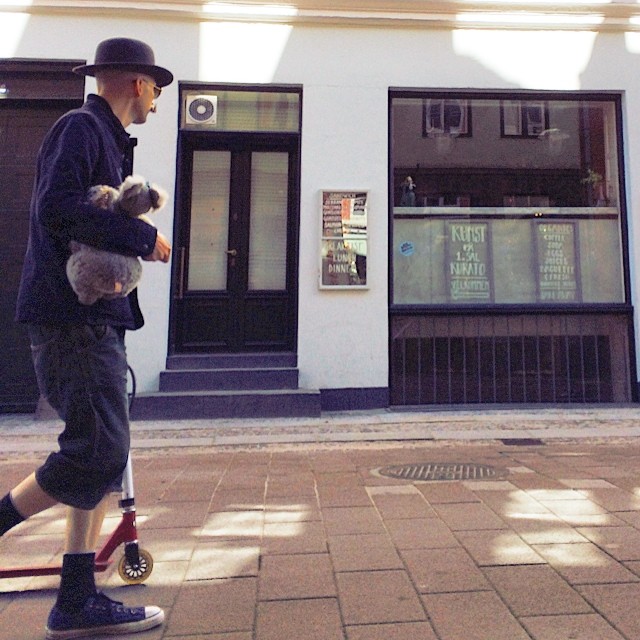 Serious #hipster in my 'hood - #handlebarmustache bowler hat, scooter and cuddly toy, or could it just be fancy dress? #copenhagen