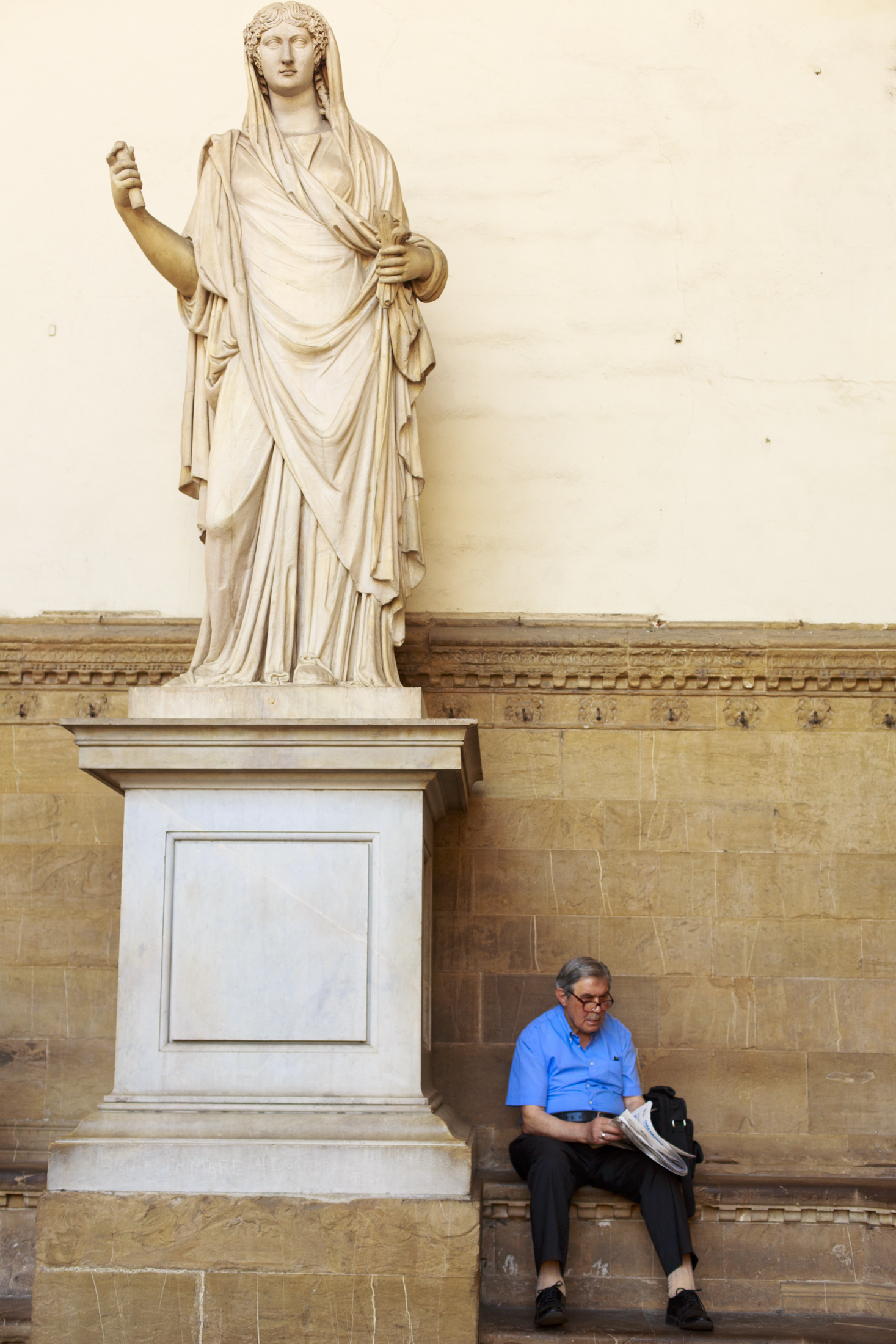 Statue and Man Reading