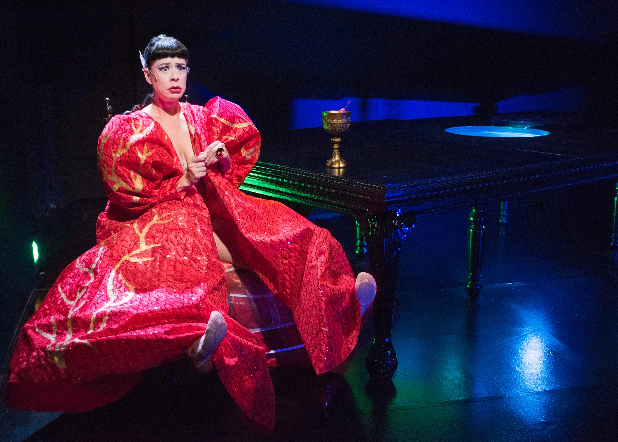 trixxie carr. Scenic Design by Maya Linke, Costume Design by Miriam Lewis, Lighting Design by Christian V. Mejia, Projection Design by Ben Randle, Sound Design by Anton Hedman. Photo by Lois Tema.