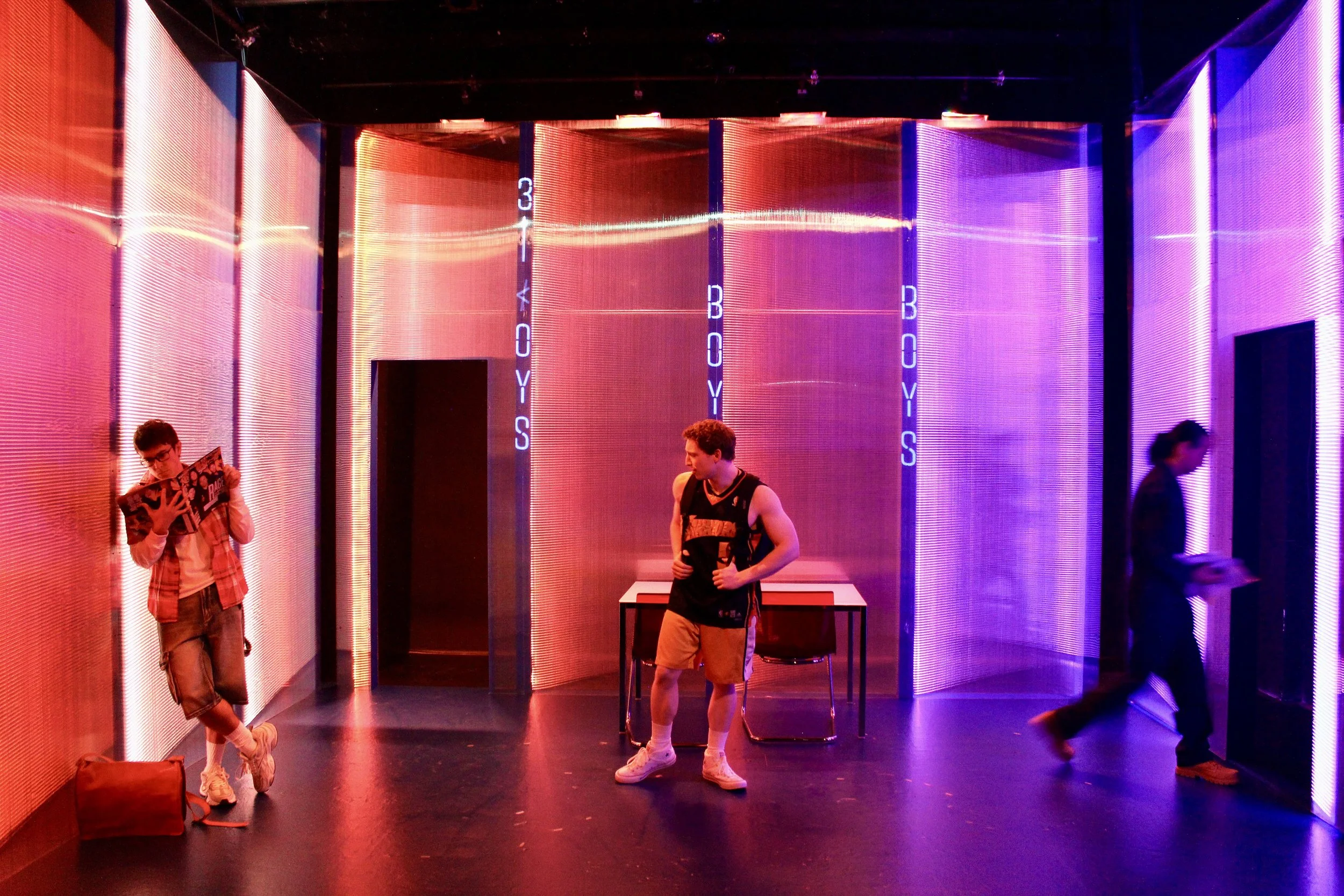   Nicholas Renee Rodriguez, Matt Skinner, Caleb Cabrera   Scenic Design by Maya Linke  Lighting and Projection Design by Spense Matubang  Costume Design by Alice Ruiz  Sound Design by Chris Sauceda  Photograph by Samuel del Rosario 