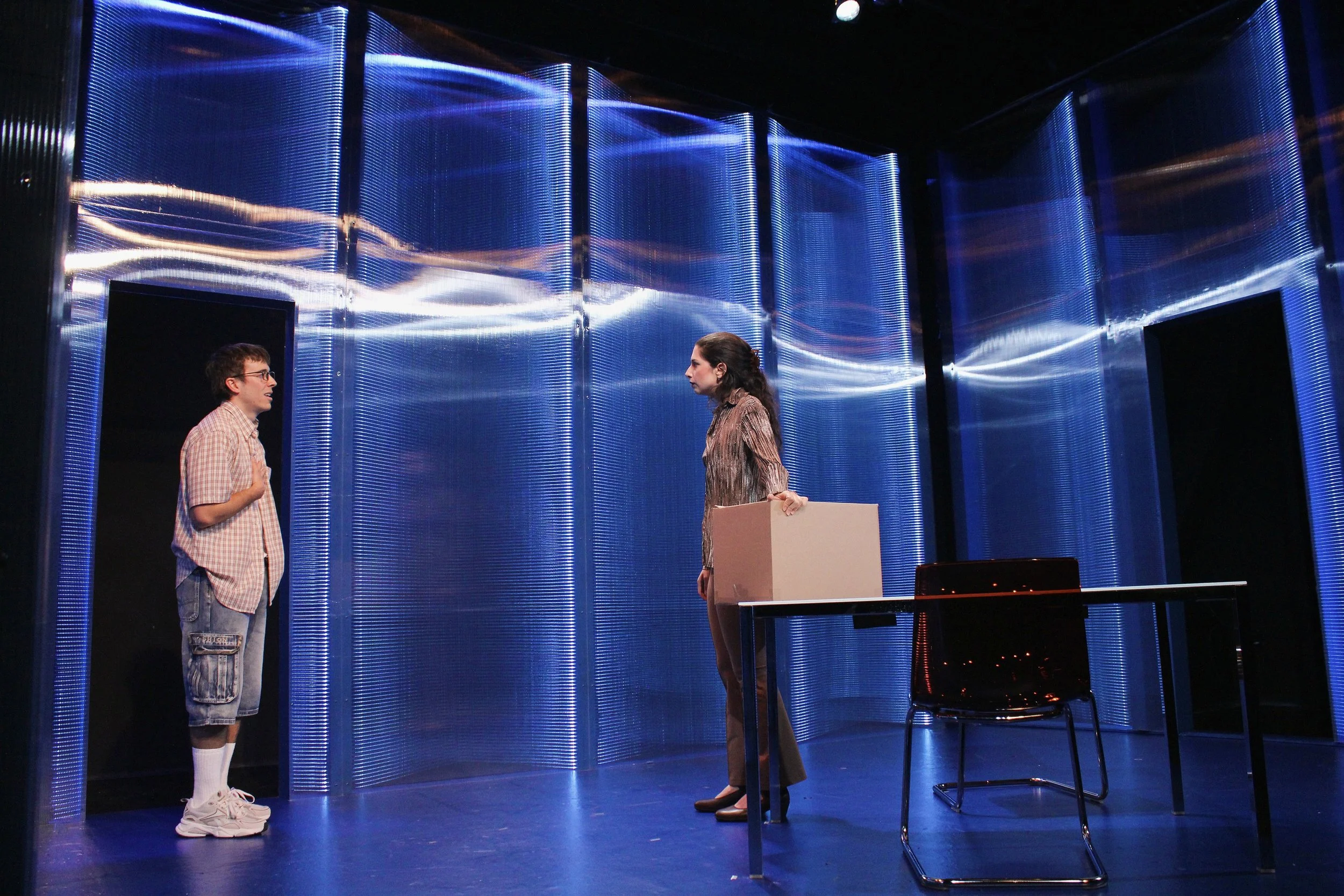   Nicholas Renee Rodriguez, Monica Rose Slater.   Scenic Design by Maya Linke  Lighting and Projection Design by Spense Matubang  Costume Design by Alice Ruiz  Sound Design by Chris Sauceda  Photograph by Samuel del Rosario 