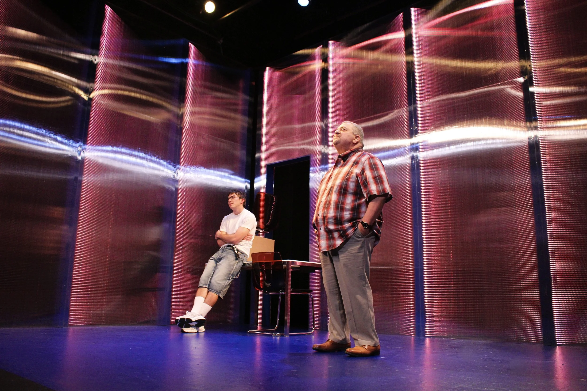   Nicholas Renee Rodriguez, Richard Perez.   Scenic Design by Maya Linke  Lighting and Projection Design by Spense Matubang  Costume Design by Alice Ruiz  Sound Design by Chris Sauceda  Photograph by Samuel del Rosario 